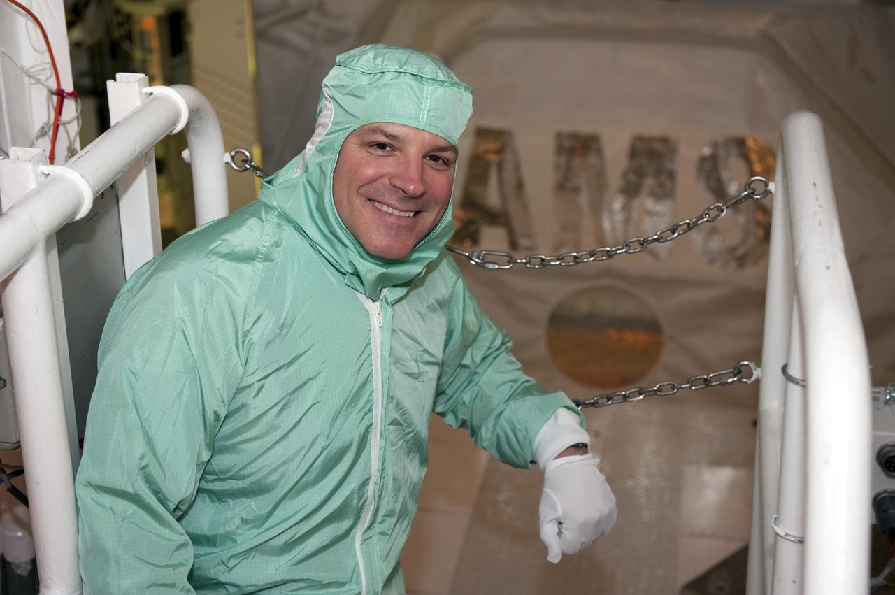 CAPE CANAVERAL, Fla. -- STS-134 Pilot Greg H. Johnson performs a walkdown of space shuttle Endeavour's payload bay. The Express Logistics Carrier-3 packed with spare parts and the Alpha Magnetic Spectrometer-2 (AMS) are inside the bay for the STS-134 mission to the International Space Station.     Endeavour's six crew members are at Kennedy for the launch countdown dress rehearsal called the Terminal Countdown Demonstration Test (TCDT) and related training. Endeavour is targeted to launch April 19 at 7:48 p.m. EDT on its final spaceflight mission. For more information visit, www.nasa.gov/mission_pages/shuttle/shuttlemissions/sts134/index.html. Photo credit: NASA/Kim Shiflett
