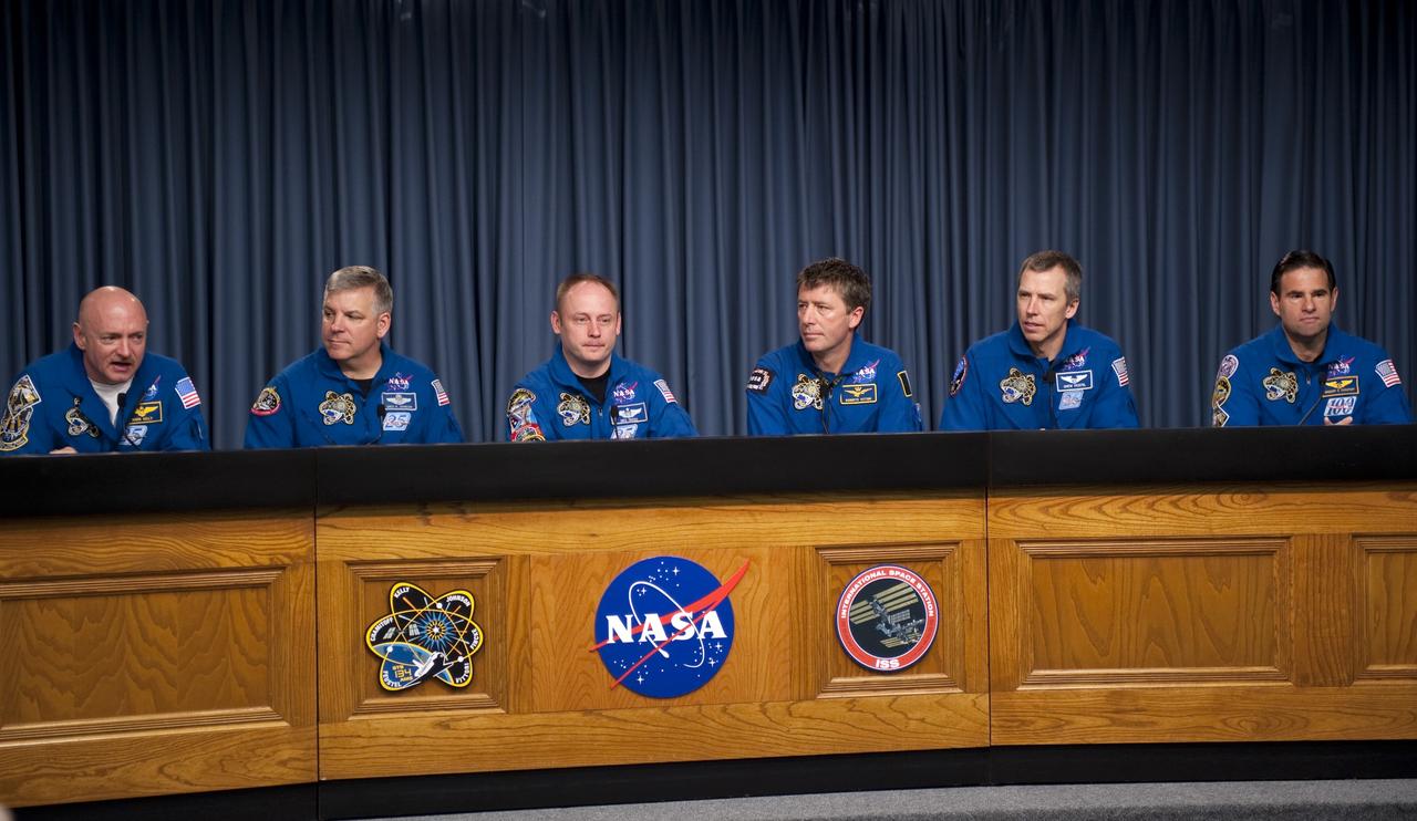 CAPE CANAVERAL, Fla. -- The STS-134 crew answers media questions in the Press Site TV auditorium at NASA's Kennedy Space Center in Florida. From left, are Commander Mark Kelly, Pilot Greg H. Johnson, and Mission Specialists Michael Fincke, European Space Agency astronaut Roberto Vittori, Andrew Feustel, and Greg Chamitoff. The crew was scheduled to answer questions at Launch Pad 39A, where space shuttle Endeavour is awaiting liftoff, but severe storms associated with a frontal system passing over Central Florida brought the media event indoors.        Endeavour's six crew members are at Kennedy for the launch countdown dress rehearsal called the Terminal Countdown Demonstration Test (TCDT) and related training. Targeted to launch April 19 at 7:48 p.m. EDT, they will deliver the Express Logistics Carrier-3, Alpha Magnetic Spectrometer-2 (AMS), a high-pressure gas tank, additional spare parts for the Dextre robotic helper and micrometeoroid debris shields to the International Space Station. This will be the final spaceflight for Endeavour. For more information visit, www.nasa.gov/mission_pages/shuttle/shuttlemissions/sts134/index.html. Photo credit: NASA/Kim Shiflett