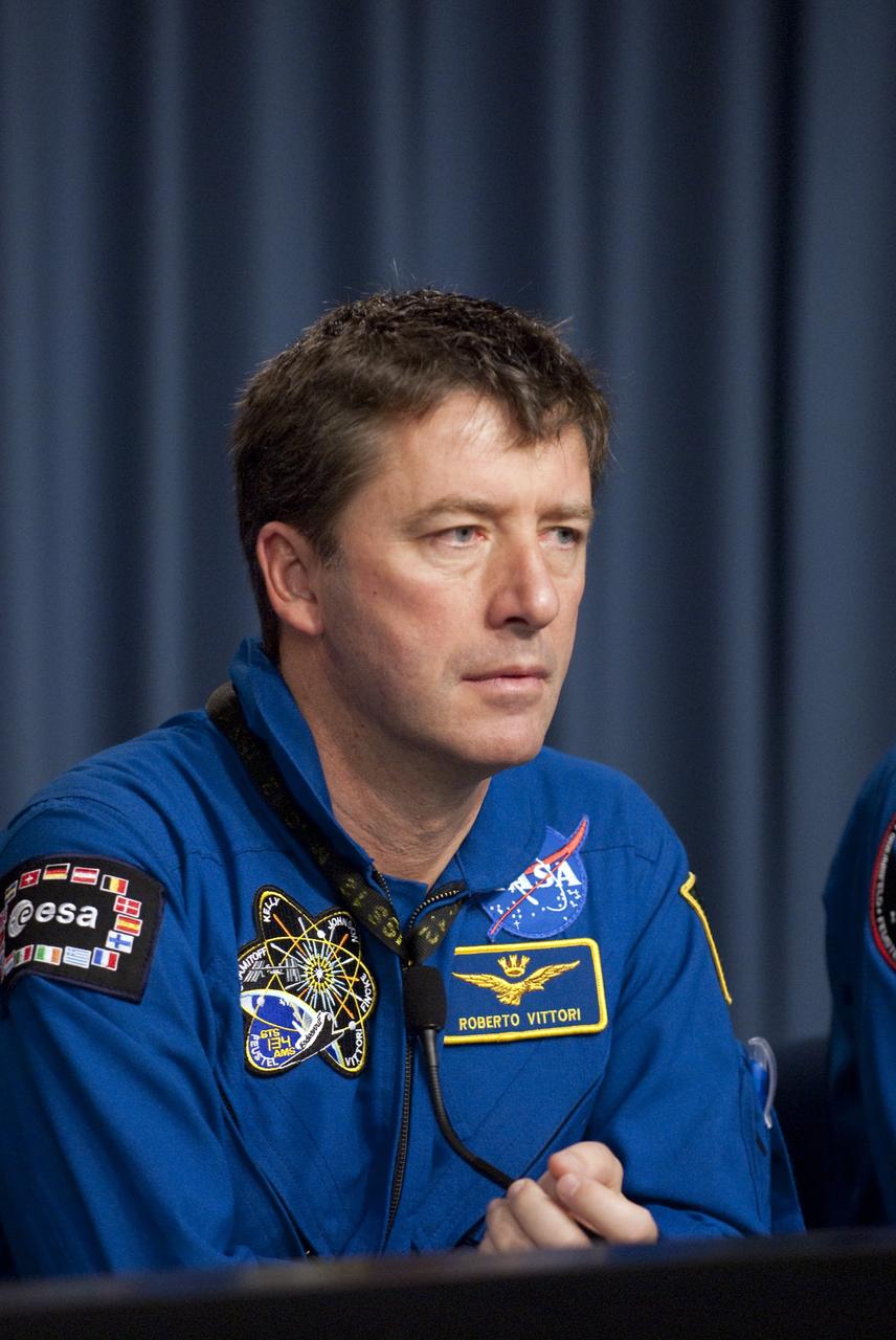 CAPE CANAVERAL, Fla. -- The STS-134 Mission Specialist Roberto Vittori, with the European Space Agency, participates in a media question-and-answer session in the Press Site TV auditorium at NASA's Kennedy Space Center in Florida. The crew was scheduled to answer questions at Launch Pad 39A, where space shuttle Endeavour is awaiting liftoff, but severe storms associated with a frontal system passing over Central Florida brought the media event indoors.        Endeavour's six crew members are at Kennedy for the launch countdown dress rehearsal called the Terminal Countdown Demonstration Test (TCDT) and related training. Targeted to launch April 19 at 7:48 p.m. EDT, they will deliver the Express Logistics Carrier-3, Alpha Magnetic Spectrometer-2 (AMS), a high-pressure gas tank, additional spare parts for the Dextre robotic helper and micrometeoroid debris shields to the International Space Station. This is the final spaceflight for Endeavour. For more information visit, www.nasa.gov/mission_pages/shuttle/shuttlemissions/sts134/index.html. Photo credit: NASA/Kim Shiflett