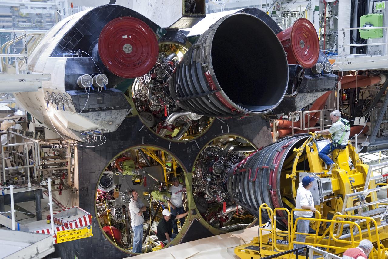 CAPE CANAVERAL, Fla. - Technicians carefully remove main engine No. 3 from space shuttle Discovery using a specially designed engine installer, called a Hyster forklift. The work is taking place in Orbiter Processing Facility-2 at NASA's Kennedy Space Center in Florida. The removal is part of Discovery's transition and retirement processing. Work performed on Discovery is expected to help rocket designers build next-generation spacecraft and prepare the shuttle for future public display.      NASA/Jim Grossmann