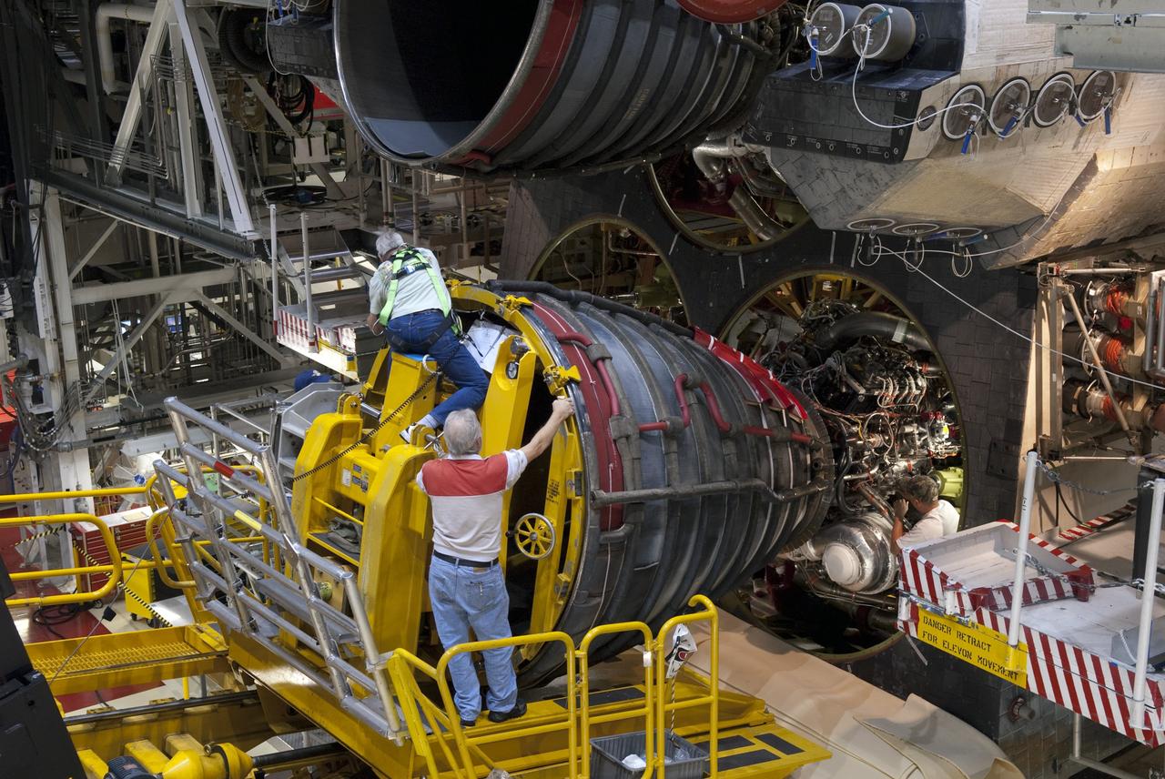 CAPE CANAVERAL, Fla. - Technicians carefully remove main engine No. 3 from space shuttle Discovery using a specially designed engine installer, called a Hyster forklift. The work is taking place in Orbiter Processing Facility-2 at NASA's Kennedy Space Center in Florida. The removal is part of Discovery's transition and retirement processing. Work performed on Discovery is expected to help rocket designers build next-generation spacecraft and prepare the shuttle for future public display.    NASA/Jim Grossmann