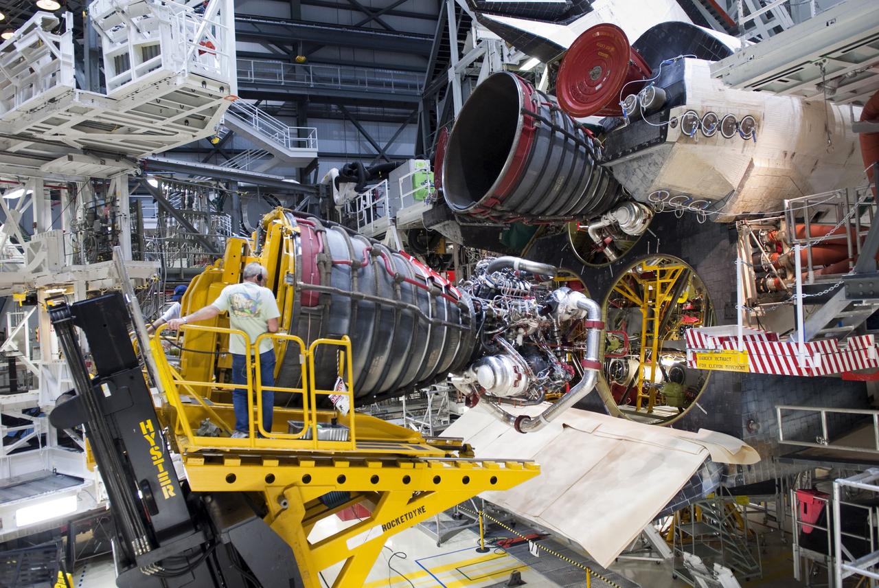 CAPE CANAVERAL, Fla. - Technicians complete the removal of main engine No. 3 from space shuttle Discovery using a specially designed engine installer, called a Hyster forklift. The work is taking place in Orbiter Processing Facility-2 at NASA's Kennedy Space Center in Florida. The removal is part of Discovery's transition and retirement processing. Work performed on Discovery is expected to help rocket designers build next-generation spacecraft and prepare the shuttle for future public display.        NASA/Jim Grossmann