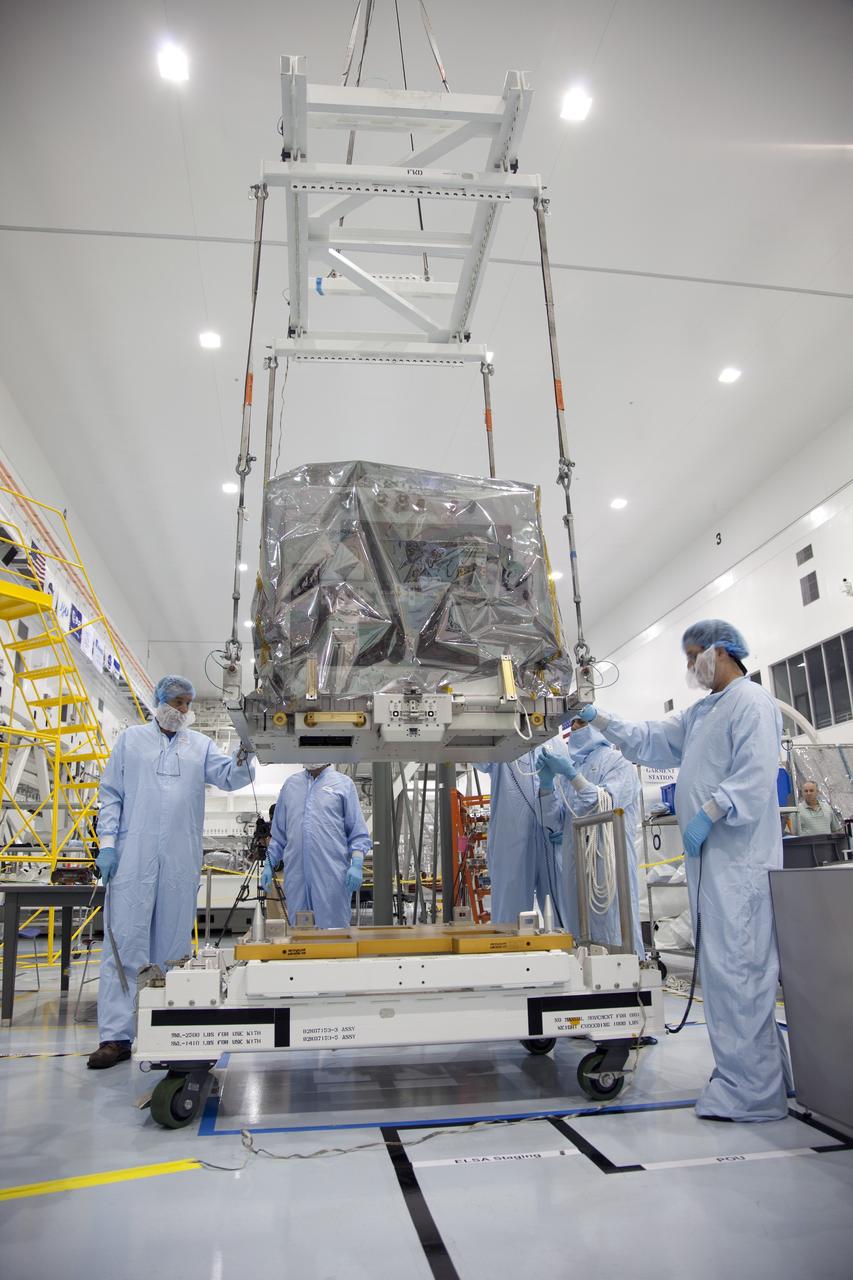 CAPE CANAVERAL, Fla. -- In the Space Station Processing Facility at NASA's Kennedy Space Center in Florida, technicians begin to move a system that will investigate the potential for robotically refueling existing spacecraft in orbit into the Lightweight Multi-Purpose Experiment Support Structure Carrier (LMC). Called the Robotic Refueling Mission (RRM), the system is being processed to fly aboard space shuttle Atlantis in the LMC on the STS-135 mission to the International Space Station. Also going up will be the Raffaello multipurpose logistics module packed with supplies, logistics and spare parts. The mission also will return a failed ammonia pump module to help NASA better understand the failure mechanism and improve pump designs for future systems. STS-135, targeted to launch June 28, will be the 33rd flight of Atlantis, the 37th shuttle mission to the space station, and the 135th and final mission of NASA's Space Shuttle Program. For more information visit, www.nasa.gov/mission_pages/shuttle/shuttlemissions/sts135/index.html. Photo credit: NASA/Ben Smegelsky