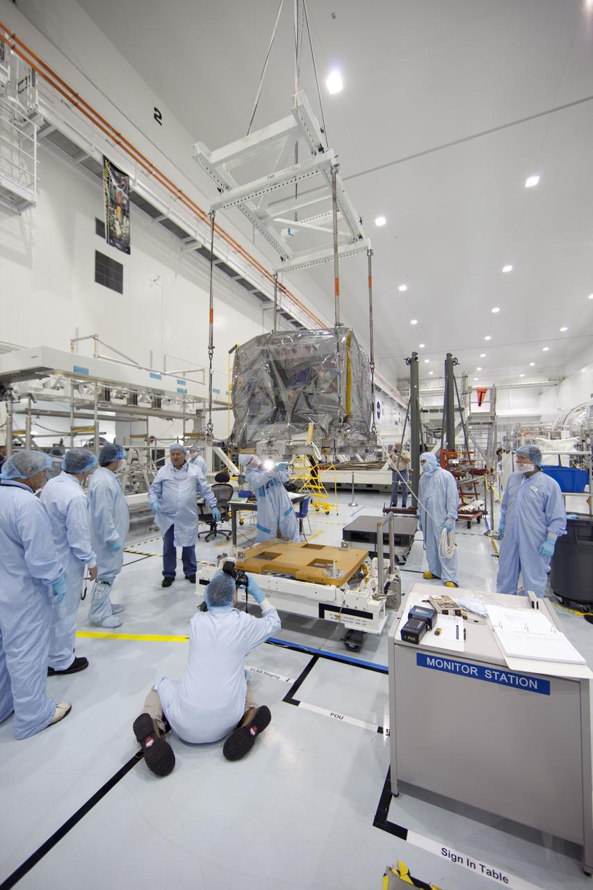 CAPE CANAVERAL, Fla. -- In the Space Station Processing Facility at NASA's Kennedy Space Center in Florida, technicians move a system that will investigate the potential for robotically refueling existing spacecraft in orbit into the Lightweight Multi-Purpose Experiment Support Structure Carrier (LMC). Called the Robotic Refueling Mission (RRM), the system is being processed to fly aboard space shuttle Atlantis in the LMC on the STS-135 mission to the International Space Station. Also going up will be the Raffaello multipurpose logistics module packed with supplies, logistics and spare parts. The mission also will return a failed ammonia pump module to help NASA better understand the failure mechanism and improve pump designs for future systems. STS-135, targeted to launch June 28, will be the 33rd flight of Atlantis, the 37th shuttle mission to the space station, and the 135th and final mission of NASA's Space Shuttle Program. For more information visit, www.nasa.gov/mission_pages/shuttle/shuttlemissions/sts135/index.html. Photo credit: NASA/Ben Smegelsky