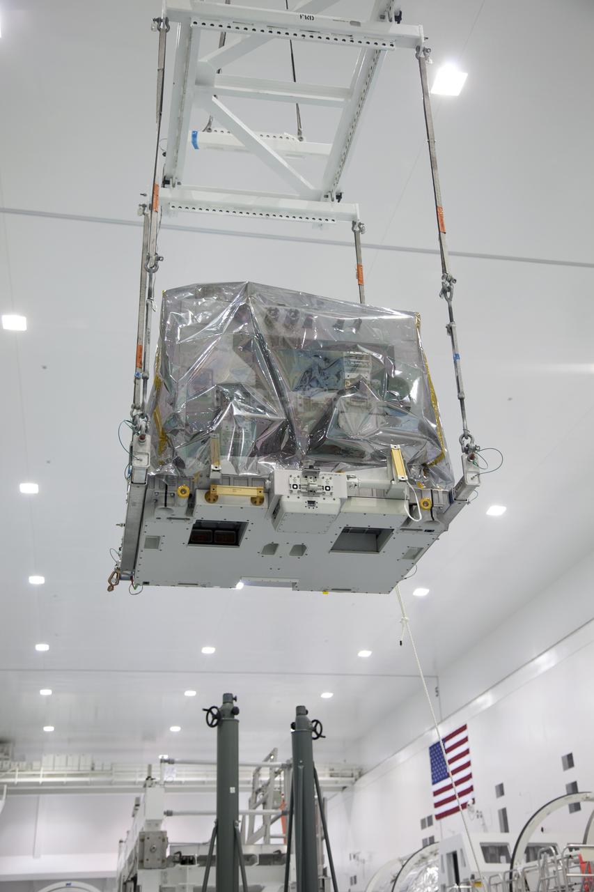 CAPE CANAVERAL, Fla. -- In the Space Station Processing Facility at NASA's Kennedy Space Center in Florida, a system that will investigate the potential for robotically refueling existing spacecraft in orbit moves toward the Lightweight Multi-Purpose Experiment Support Structure Carrier (LMC). Called the Robotic Refueling Mission (RRM), the system is being processed to fly aboard space shuttle Atlantis in the LMC on the STS-135 mission to the International Space Station. Also going up will be the Raffaello multipurpose logistics module packed with supplies, logistics and spare parts. The mission also will return a failed ammonia pump module to help NASA better understand the failure mechanism and improve pump designs for future systems. STS-135, targeted to launch June 28, will be the 33rd flight of Atlantis, the 37th shuttle mission to the space station, and the 135th and final mission of NASA's Space Shuttle Program. For more information visit, www.nasa.gov/mission_pages/shuttle/shuttlemissions/sts135/index.html. Photo credit: NASA/Ben Smegelsky