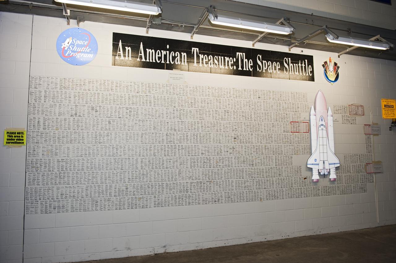CAPE CANAVERAL, Fla. -- The space shuttle wall tribute in the Vehicle Assembly Building at NASA's Kennedy Space Center in Florida is filling up with the signatures of employees who have supported the Space Shuttle Program throughout the last 30 years.     Photo credit: NASA/Kim Shiflett