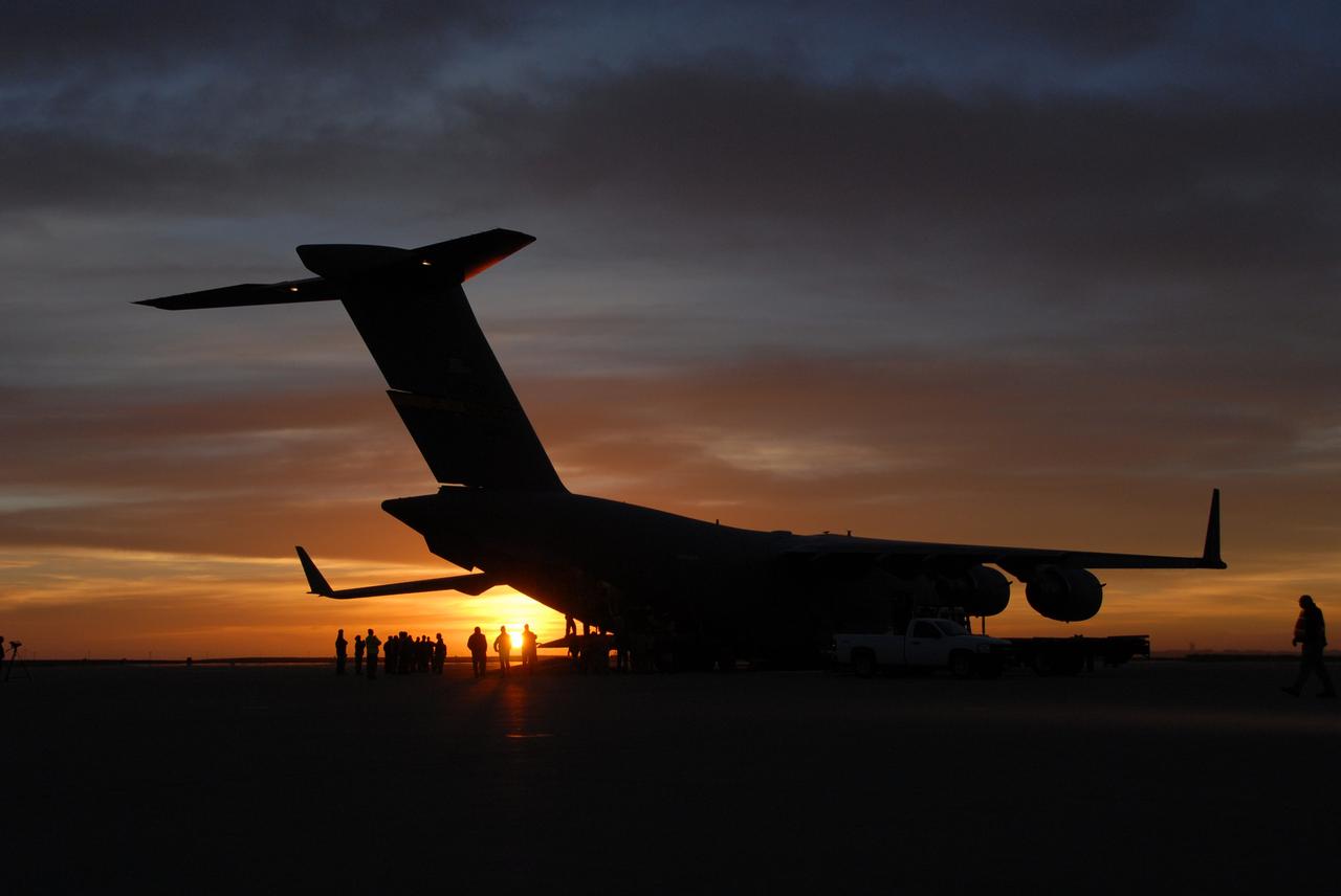 VANDENBERG AIR FORCE BASE, Calif. -- Workers at Vandenberg Air Force Base in California prepare to offload the Aquarius/SAC-D spacecraft from a U.S. Air Force C-17 transport plane. The aircraft traveled from Campos, Brazil. Following final tests, the spacecraft will be integrated to a United Launch Alliance Delta II rocket in preparation for the targeted June launch to low Earth orbit.    Aquarius, the NASA-built primary instrument on the SAC-D spacecraft, will map global changes in salinity at the ocean's surface. Salinity is a key measurement for understanding how changes in rainfall, evaporation and the melting of freezing of ice influence ocean circulation and are linked to variations in Earth's climate. The three-year mission will provide new insights into how variations in ocean surface salinity relate to these fundamental climate processes. Photo credit: VAFB/30th Space Wing