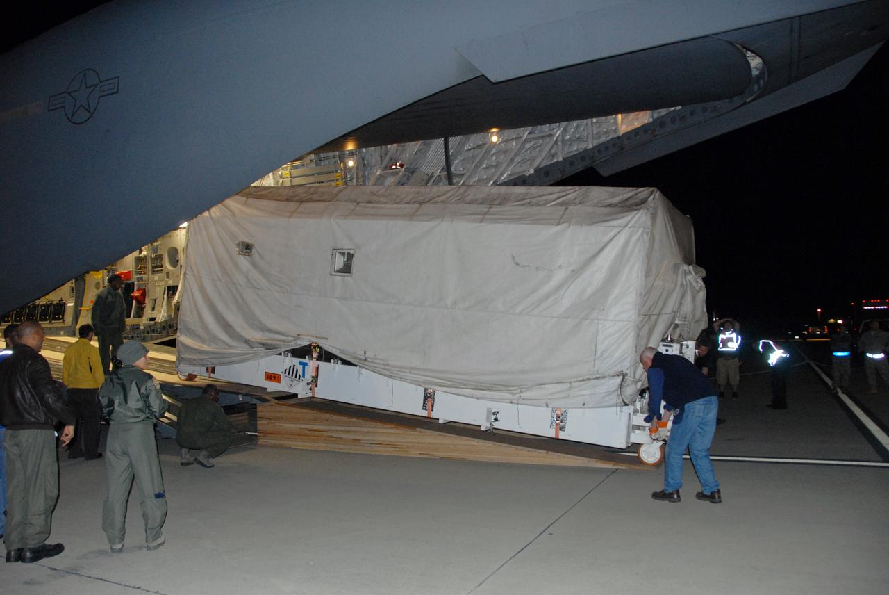 VANDENBERG AIR FORCE BASE, Calif. -- The Aquarius/SAC-D spacecraft is offloaded from a U.S. Air Force C-17 transport at Vandenberg Air Force Base in California. The aircraft traveled from Campos, Brazil. Following final tests, the spacecraft will be integrated to a United Launch Alliance Delta II rocket in preparation for the targeted June launch to low Earth orbit.      Aquarius, the NASA-built primary instrument on the SAC-D spacecraft, will map global changes in salinity at the ocean's surface. Salinity is a key measurement for understanding how changes in rainfall, evaporation and the melting of freezing of ice influence ocean circulation and are linked to variations in Earth's climate. The three-year mission will provide new insights into how variations in ocean surface salinity relate to these fundamental climate processes. Photo credit: VAFB/30th Space Wing