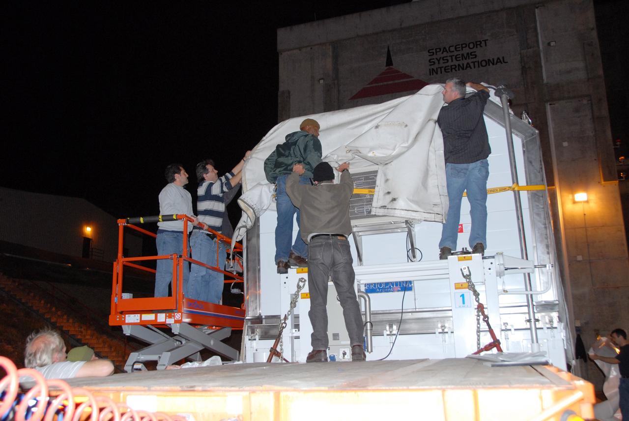 VANDENBERG AIR FORCE BASE, Calif. -- The Aquarius/SAC-D spacecraft is transported to the Spaceport Systems International processing facility at Vandenberg Air Force Base in California.  Earlier, a U.S. Air Force C-17 transport plane delivered the spacecraft from Campos, Brazil. Following final tests, the spacecraft will be integrated to a United Launch Alliance Delta II rocket in preparation for the targeted June launch to low Earth orbit.    Aquarius, the NASA-built primary instrument on the SAC-D spacecraft, will map global changes in salinity at the ocean's surface. Salinity is a key measurement for understanding how changes in rainfall, evaporation and the melting of freezing of ice influence ocean circulation and are linked to variations in Earth's climate. The three-year mission will provide new insights into how variations in ocean surface salinity relate to these fundamental climate processes. Photo credit: VAFB/30th Space Wing