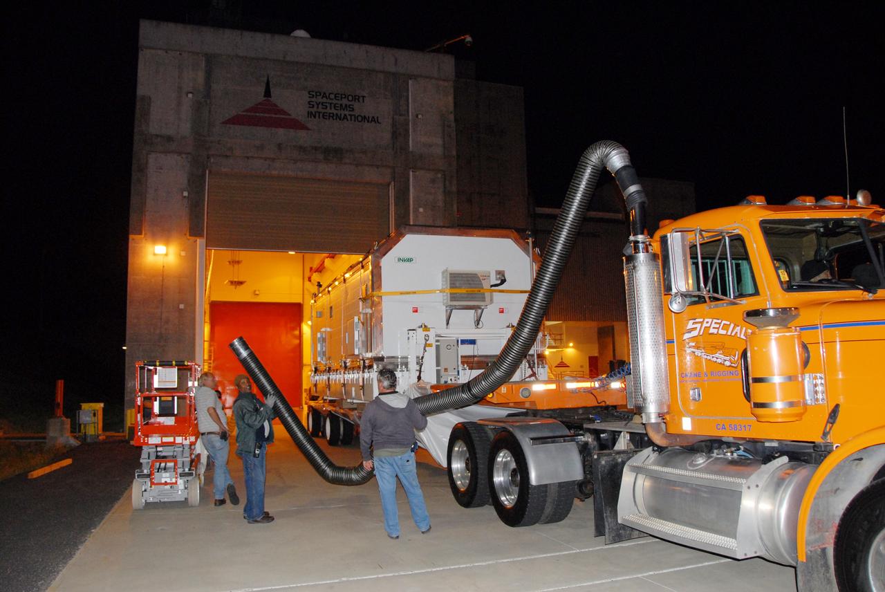 VANDENBERG AIR FORCE BASE, Calif. -- The Aquarius/SAC-D spacecraft is transported to the Spaceport Systems International payload processing facility at Vandenberg Air Force Base in California.  Earlier, a U.S. Air Force C-17 transport plane delivered the spacecraft from Campos, Brazil. Following final tests, the spacecraft will be integrated to a United Launch Alliance Delta II rocket in preparation for the targeted June launch to low Earth orbit.          Aquarius, the NASA-built primary instrument on the SAC-D spacecraft, will map global changes in salinity at the ocean's surface. Salinity is a key measurement for understanding how changes in rainfall, evaporation and the melting of freezing of ice influence ocean circulation and are linked to variations in Earth's climate. The three-year mission will provide new insights into how variations in ocean surface salinity relate to these fundamental climate processes. Photo credit: VAFB/30th Space Wing