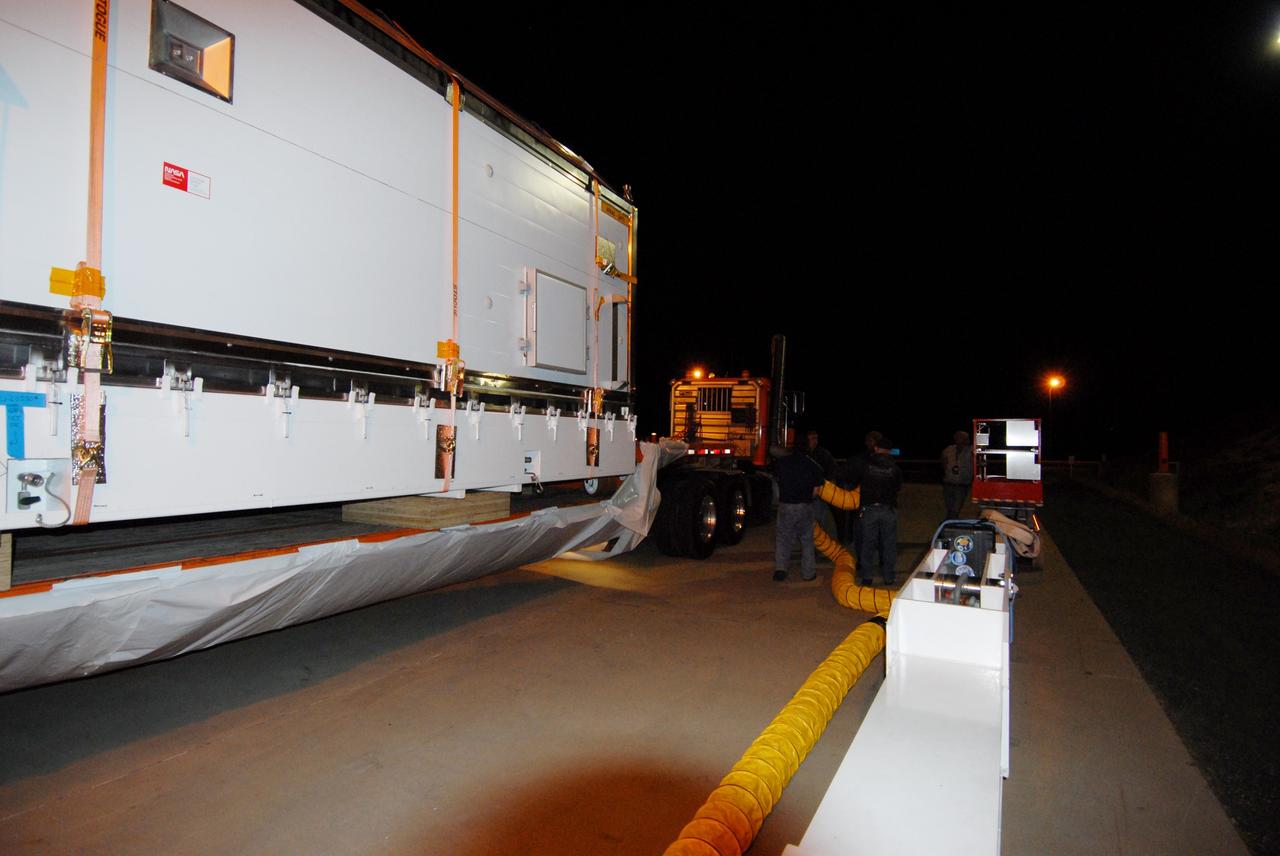 VANDENBERG AIR FORCE BASE, Calif. -- The Aquarius/SAC-D spacecraft is transported to the Spaceport Systems International payload processing facility at Vandenberg Air Force Base in California.  Earlier, a U.S. Air Force C-17 transport plane delivered the spacecraft from Campos, Brazil. Following final tests, the spacecraft will be integrated to a United Launch Alliance Delta II rocket in preparation for the targeted June launch to low Earth orbit.        Aquarius, the NASA-built primary instrument on the SAC-D spacecraft, will map global changes in salinity at the ocean's surface. Salinity is a key measurement for understanding how changes in rainfall, evaporation and the melting of freezing of ice influence ocean circulation and are linked to variations in Earth's climate. The three-year mission will provide new insights into how variations in ocean surface salinity relate to these fundamental climate processes. Photo credit: VAFB/30th Space Wing
