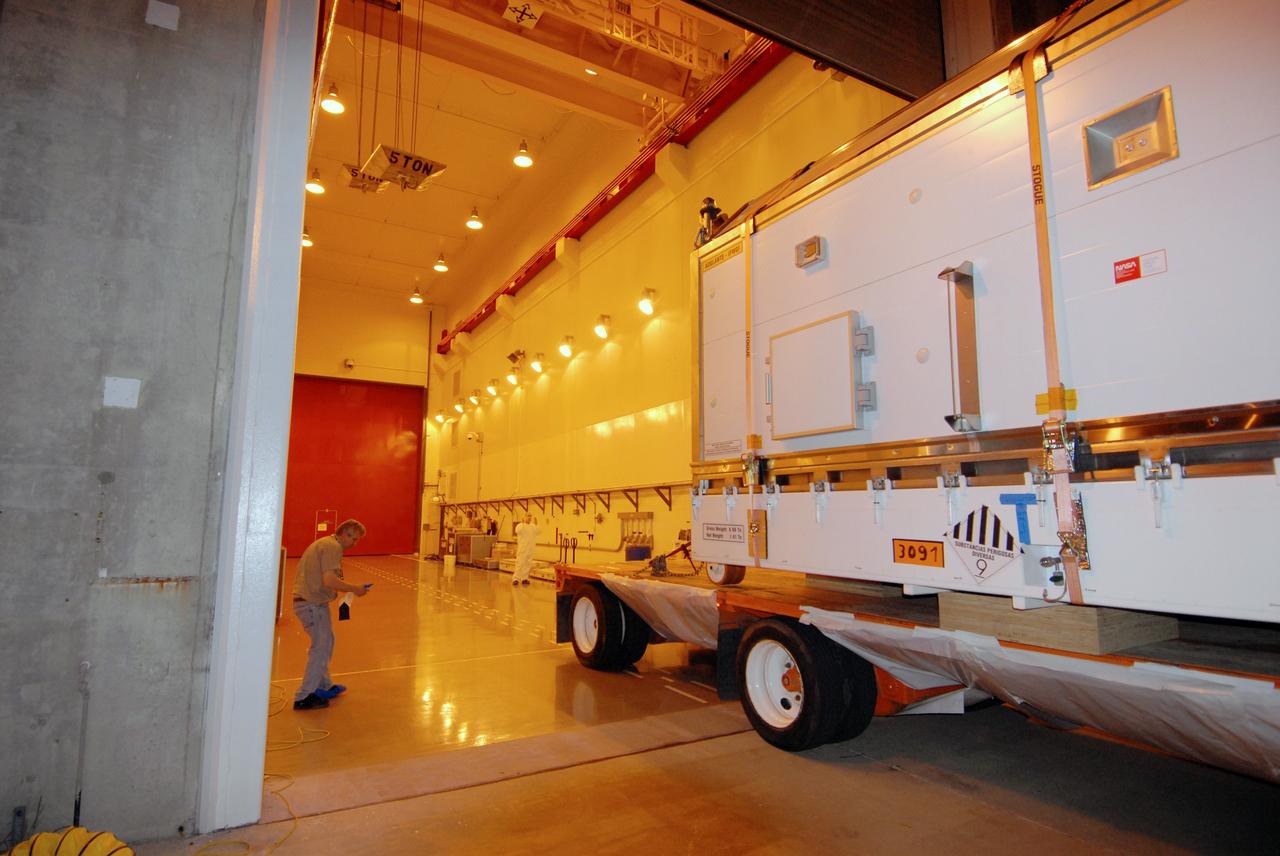 VANDENBERG AIR FORCE BASE, Calif. -- The Aquarius/SAC-D spacecraft enters the Spaceport Systems International payload processing facility at Vandenberg Air Force Base in California.  Earlier, a U.S. Air Force C-17 transport plane delivered the spacecraft from Campos, Brazil. Following final tests, the spacecraft will be integrated to a United Launch Alliance Delta II rocket in preparation for the targeted June launch to low Earth orbit.      Aquarius, the NASA-built primary instrument on the SAC-D spacecraft, will map global changes in salinity at the ocean's surface. Salinity is a key measurement for understanding how changes in rainfall, evaporation and the melting of freezing of ice influence ocean circulation and are linked to variations in Earth's climate. The three-year mission will provide new insights into how variations in ocean surface salinity relate to these fundamental climate processes. Photo credit: VAFB/30th Space Wing
