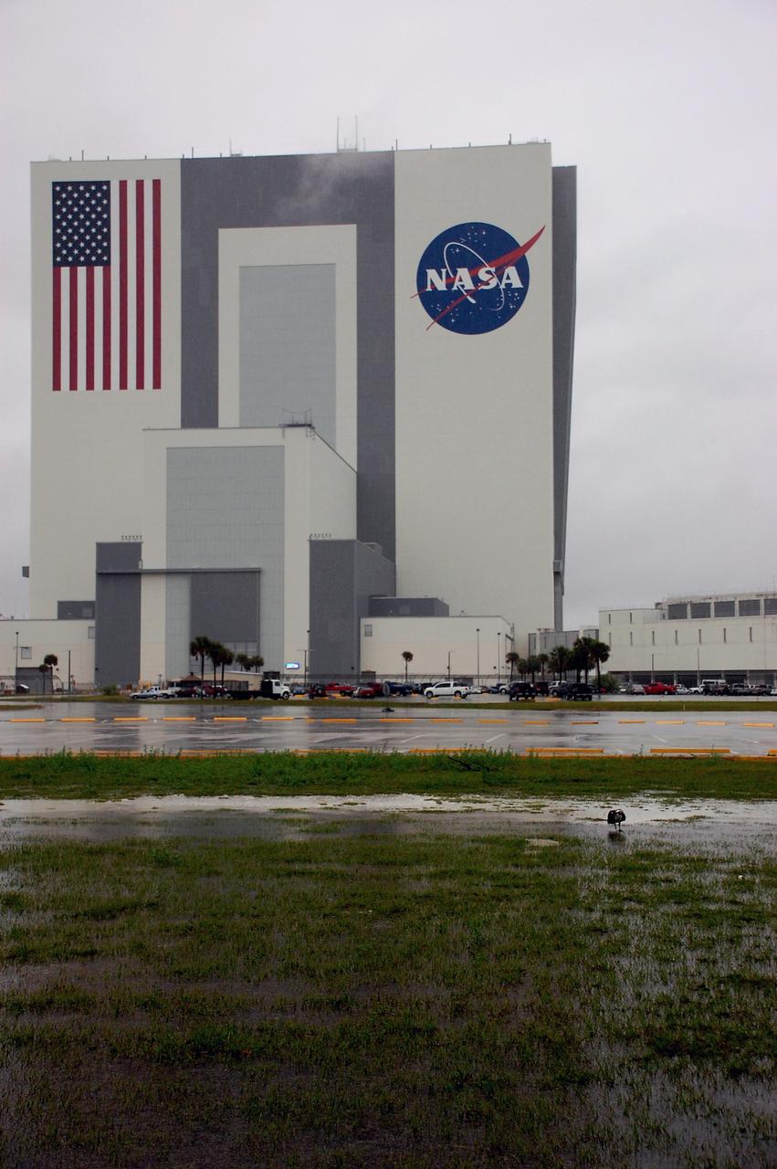 CAPE CANAVERAL, Fla. – An osprey wades in flooded grass near the Vehicle Assembly Building at NASA's Kennedy Space Center in Florida. Severe storms associated with a frontal system are moving through Central Florida, producing strong winds, heavy rain, frequent lightning and even funnel clouds. Photo credit: NASA/Ben Smegelsky