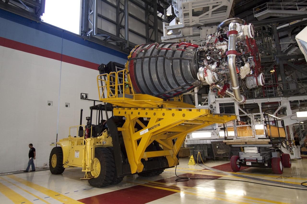 CAPE CANAVERAL, Fla. - Technicians complete the removal of main engine No. 1 from space shuttle Discovery using a specially designed engine installer, called a Hyster forklift. The work is taking place in Orbiter Processing Facility-2 at NASA's Kennedy Space Center in Florida. The removal is part of Discovery's transition and retirement processing. Work performed on Discovery is expected to help rocket designers build next-generation spacecraft and prepare the shuttle for future public display.    Photo credit: NASA/Jack Pfaller