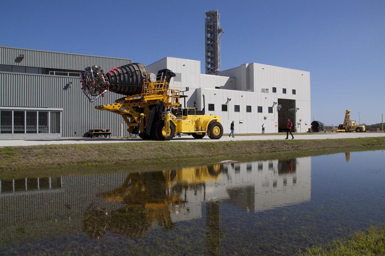CAPE CANAVERAL, Fla. - Main engine No. 1, which was removed from space shuttle Discovery, is transported from Orbiter Processing Facility-2 to the Space Shuttle Main Engine Processing Facility at NASA's Kennedy Space Center in Florida. The removal was part of Discovery's transition and retirement processing. Work performed on Discovery is expected to help rocket designers build next-generation spacecraft and prepare the shuttle for future public display.    Photo credit: NASA/Jack Pfaller