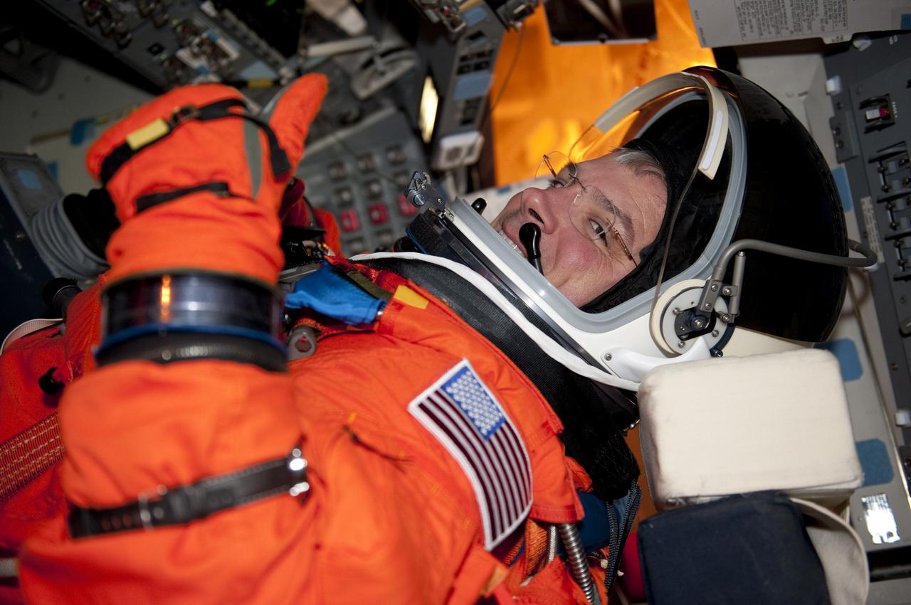 CAPE CANAVERAL, Fla. -- STS-134 Pilot Greg H. Johnson gives a thumbs-up as he takes his seat aboard space shuttle Endeavour during the Terminal Countdown Demonstration Test (TCDT) on Launch Pad 39A at NASA's Kennedy Space Center in Florida. Part of TCDT includes practicing the final hours of a real launch day when astronauts put on their launch-and-entry suits, ride to the pad in the Astrovan and strap into the shuttle. Endeavour's six crew members are targeted to launch April 19 at 7:48 p.m. EDT. They will deliver the Express Logistics Carrier-3, Alpha Magnetic Spectrometer-2 (AMS), a high-pressure gas tank, additional spare parts for the Dextre robotic helper and micrometeoroid debris shields to the International Space Station. This will be the final spaceflight for Endeavour. For more information visit, www.nasa.gov/mission_pages/shuttle/shuttlemissions/sts134/index.html. Photo credit: NASA/Kim Shiflett