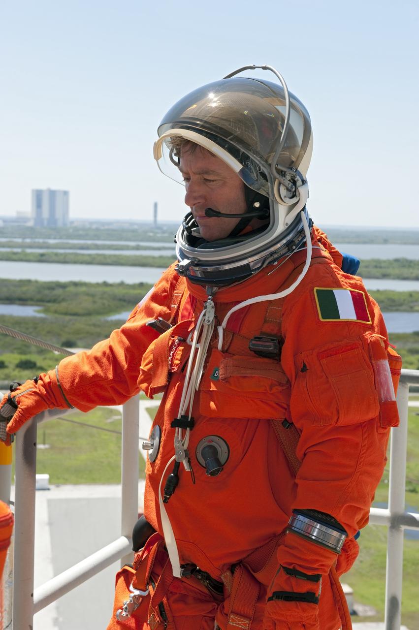 CAPE CANAVERAL, Fla. - During a simulated pad emergency on Launch Pad 39A at NASA's Kennedy Space Center in Florida, STS-134 Mission Specialist Roberto Vittori, with the European Space Agency, hops in a slidewire basket that would take him to a safe bunker below the pad in an unlikely emergency situation. The emergency training while aboard space shuttle Discovery is part of a week-long Terminal Countdown Demonstration Test (TCDT). Endeavour's six crew members are targeted to launch April 19 at 7:48 p.m. EDT. They will deliver the Express Logistics Carrier-3, Alpha Magnetic Spectrometer-2 (AMS), a high-pressure gas tank, additional spare parts for the Dextre robotic helper and micrometeoroid debris shields to the International Space Station. This will be the final spaceflight for Endeavour. For more information visit, www.nasa.gov/mission_pages/shuttle/shuttlemissions/sts134/index.html. Photo credit: NASA/Kim Shiflett