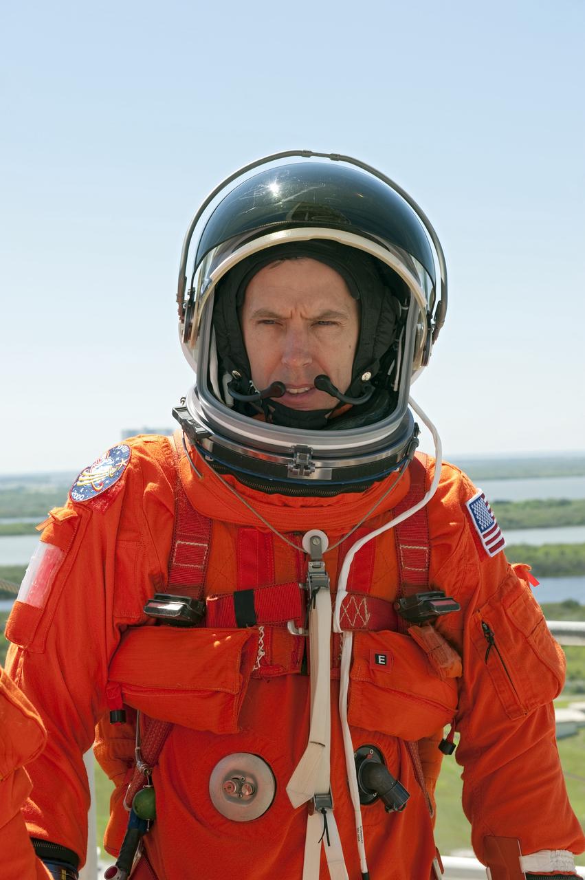 CAPE CANAVERAL, Fla. -- During a simulated pad emergency on Launch Pad 39A at NASA's Kennedy Space Center in Florida, STS-134 Mission Specialist Andrew Feustel hops in a slidewire basket that would take him to a safe bunker below the pad in an unlikely emergency situation. The emergency training while aboard space shuttle Discovery is part of a week-long Terminal Countdown Demonstration Test (TCDT). Endeavour's six crew members are targeted to launch April 19 at 7:48 p.m. EDT. They will deliver the Express Logistics Carrier-3, Alpha Magnetic Spectrometer-2 (AMS), a high-pressure gas tank, additional spare parts for the Dextre robotic helper and micrometeoroid debris shields to the International Space Station. This will be the final spaceflight for Endeavour. For more information visit, www.nasa.gov/mission_pages/shuttle/shuttlemissions/sts134/index.html. Photo credit: NASA/Kim Shiflett