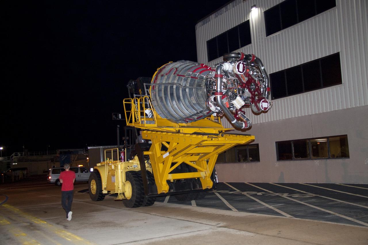 CAPE CANAVERAL, Fla. - Space shuttle main engine No. 2, which was removed from shuttle Discovery, is transported from Orbiter Processing Facility-2 to the Space Shuttle Main Engine Processing Facility at NASA's Kennedy Space Center in Florida. The removal was part of Discovery's transition and retirement processing. Work performed on Discovery is expected to help rocket designers build next-generation spacecraft and prepare the shuttle for future public display. Photo credit: NASA/Jack Pfaller