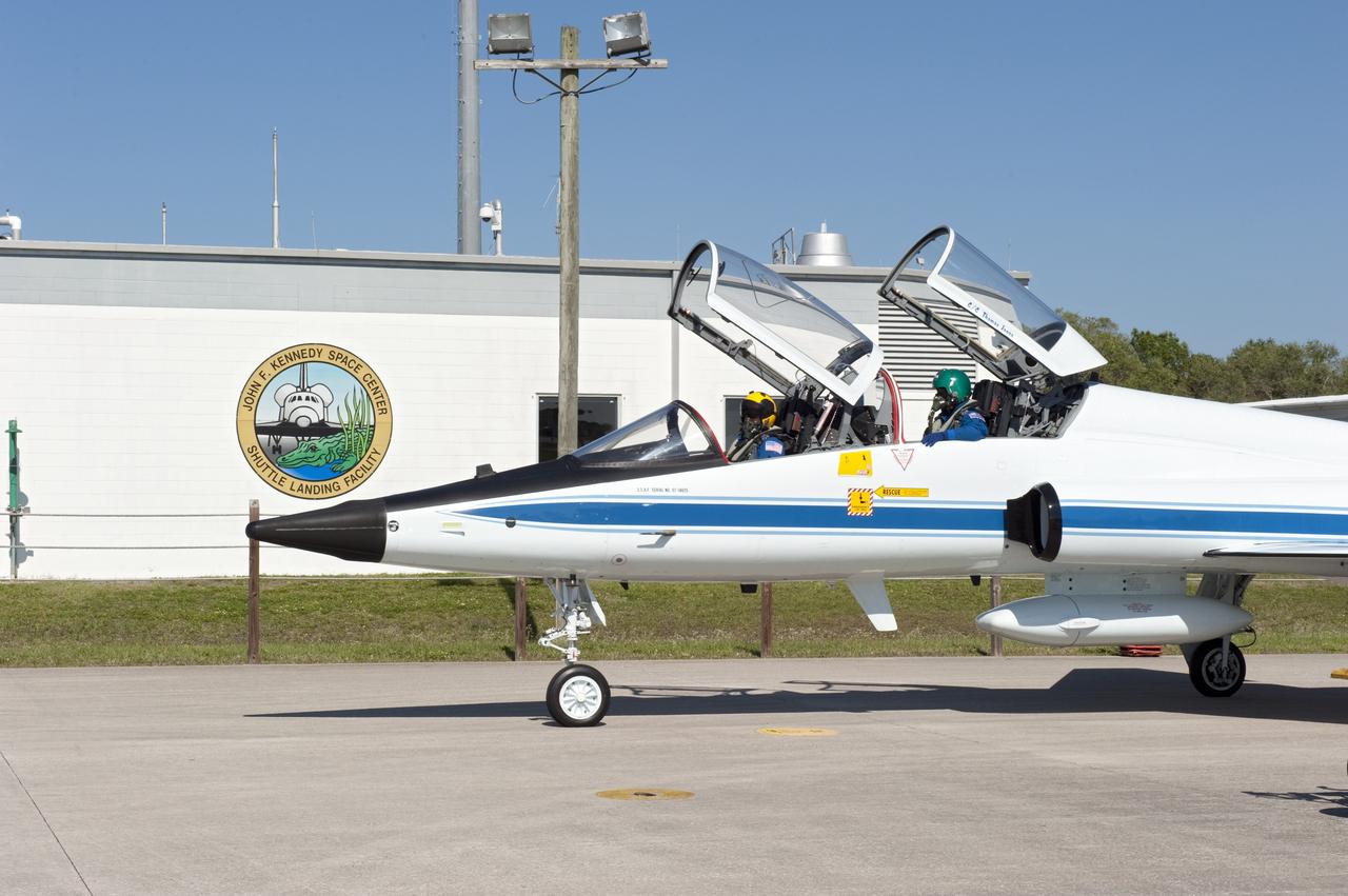 CAPE CANAVERAL, Fla. -- STS-134 Commander Mark Kelly, left, and Mission Specialist Michael Fincke prepare to depart the Shuttle Landing Facility at NASA's Kennedy Space Center in Florida aboard a T-38 jet. While at Kennedy, space shuttle Endeavour's crew participated in a launch countdown dress rehearsal called the Terminal Countdown Demonstration Test (TCDT) and related training. The pair will return to NASA's Johnson Space Center in Houston to resume training for their upcoming mission. Endeavour and its six STS-134 crew members will deliver the Express Logistics Carrier-3, Alpha Magnetic Spectrometer-2 (AMS), a high-pressure gas tank, additional spare parts for the Dextre robotic helper and micrometeoroid debris shields to the International Space Station. This will be the final spaceflight for Endeavour. Launch is targeted for April 29 at 3:47 p.m. EDT. For more information visit, www.nasa.gov/mission_pages/shuttle/shuttlemissions/sts134/index.html. Photo credit: NASA/Kim Shiflett