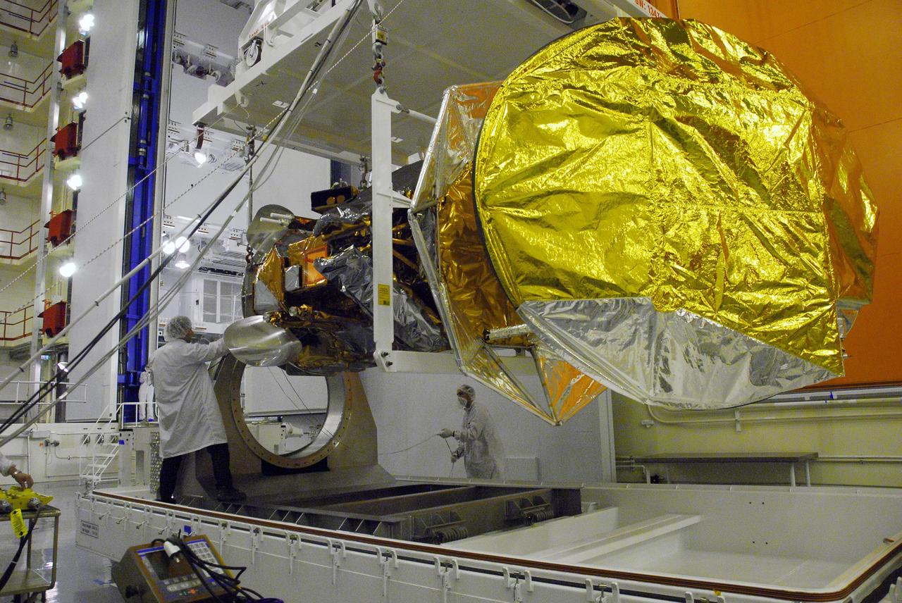 VANDENBERG AIR FORCE BASE, Calif. -- With the aid of an overhead crane, technicians guide the Aquarius/SAC-D spacecraft from its stand to cell 3 at the Spaceport Systems International payload processing facility at Vandenberg Air Force Base in California. There, the spacecraft will undergo inspection of its solar arrays and tests will be conducted on its propulsion subsystem. Further testing of the satellites various other systems will follow.              Following final tests, the spacecraft will be integrated to a United Launch Alliance Delta II rocket in preparation for the targeted June launch. Aquarius, the NASA-built primary instrument on the SAC-D spacecraft, will map global changes in salinity at the ocean's surface. The three-year mission will provide new insights into how variations in ocean surface salinity relate to these fundamental climate processes. Photo credit: NASA/Randy Beaudoin, VAFB