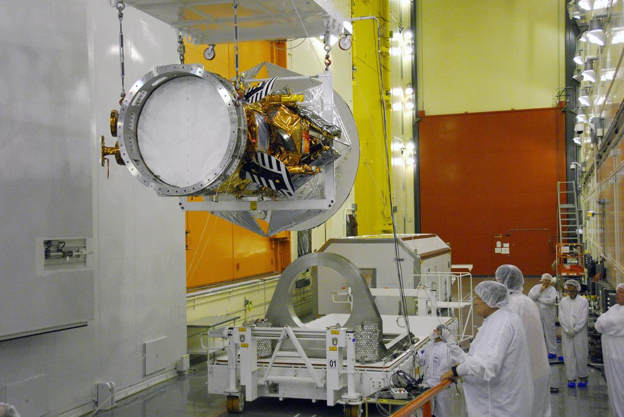 VANDENBERG AIR FORCE BASE, Calif. -- Technicians monitor the Aquarius/SAC-D spacecraft as it is being moved by an overhead crane from its stand to cell 3 at the Spaceport Systems International payload processing facility at Vandenberg Air Force Base in California. There, the spacecraft will undergo inspection of its solar arrays and tests will be conducted on its propulsion subsystem. Further testing of the satellites various other systems will follow.        Following final tests, the spacecraft will be integrated to a United Launch Alliance Delta II rocket in preparation for the targeted June launch. Aquarius, the NASA-built primary instrument on the SAC-D spacecraft, will map global changes in salinity at the ocean's surface. The three-year mission will provide new insights into how variations in ocean surface salinity relate to these fundamental climate processes. Photo credit: NASA/Randy Beaudoin, VAFB