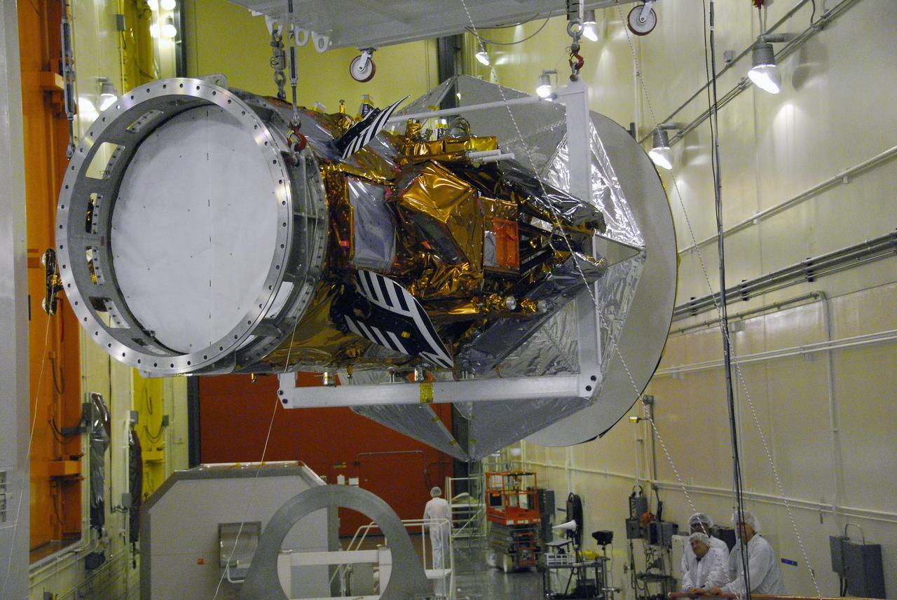 VANDENBERG AIR FORCE BASE, Calif. -- Technicians monitor the Aquarius/SAC-D spacecraft as it is being moved by an overhead crane from its stand to cell 3 at the Spaceport Systems International payload processing facility at Vandenberg Air Force Base in California. There, the spacecraft will undergo inspection of its solar arrays and tests will be conducted on its propulsion subsystem. Further testing of the satellites various other systems will follow.        Following final tests, the spacecraft will be integrated to a United Launch Alliance Delta II rocket in preparation for the targeted June launch. Aquarius, the NASA-built primary instrument on the SAC-D spacecraft, will map global changes in salinity at the ocean's surface. The three-year mission will provide new insights into how variations in ocean surface salinity relate to these fundamental climate processes. Photo credit: NASA/Randy Beaudoin, VAFB
