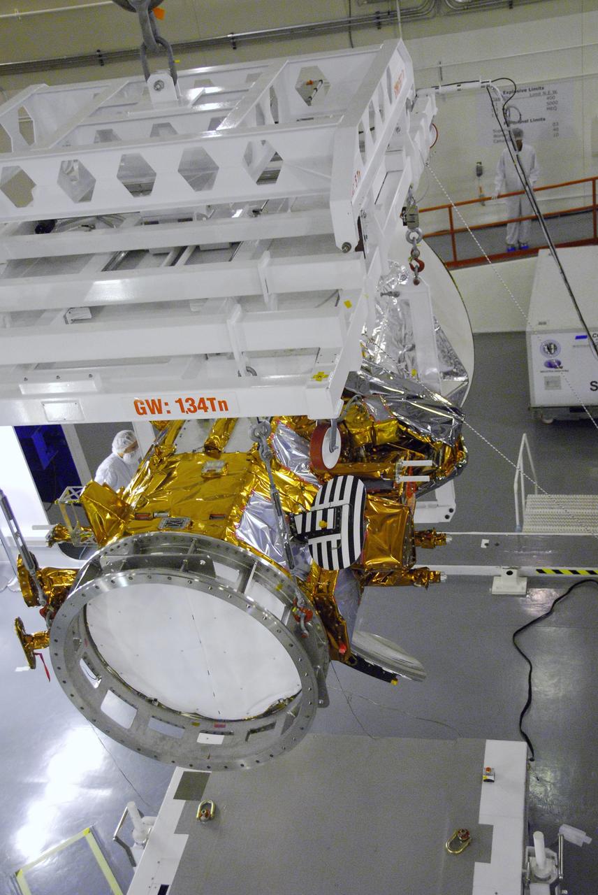 VANDENBERG AIR FORCE BASE, Calif. -- An overhead crane moves the Aquarius/SAC-D spacecraft to cell 3 at the Spaceport Systems International payload processing facility at Vandenberg Air Force Base in California. There, the spacecraft will undergo inspection of its solar arrays and tests will be conducted on its propulsion subsystem. Further testing of the satellites various other systems will follow.      Following final tests, the spacecraft will be integrated to a United Launch Alliance Delta II rocket in preparation for the targeted June launch. Aquarius, the NASA-built primary instrument on the SAC-D spacecraft, will map global changes in salinity at the ocean's surface. The three-year mission will provide new insights into how variations in ocean surface salinity relate to these fundamental climate processes. Photo credit: NASA/Randy Beaudoin, VAFB