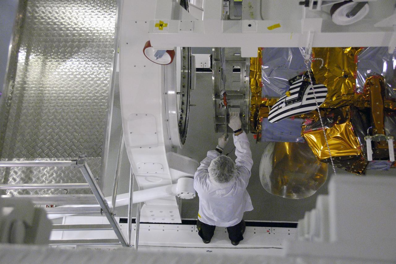 VANDENBERG AIR FORCE BASE, Calif. -- A technician guides the Aquarius/SAC-D spacecraft toward the Rotation and Test Fixture in cell 3 at the Spaceport Systems International payload processing facility at Vandenberg Air Force Base in California. There, the spacecraft will undergo inspection of its solar arrays and tests will be conducted on its propulsion subsystem. Further testing of the satellites various other systems will follow.    Following final tests, the spacecraft will be integrated to a United Launch Alliance Delta II rocket in preparation for the targeted June launch. Aquarius, the NASA-built primary instrument on the SAC-D spacecraft, will map global changes in salinity at the ocean's surface. The three-year mission will provide new insights into how variations in ocean surface salinity relate to these fundamental climate processes. Photo credit: NASA/Randy Beaudoin, VAFB