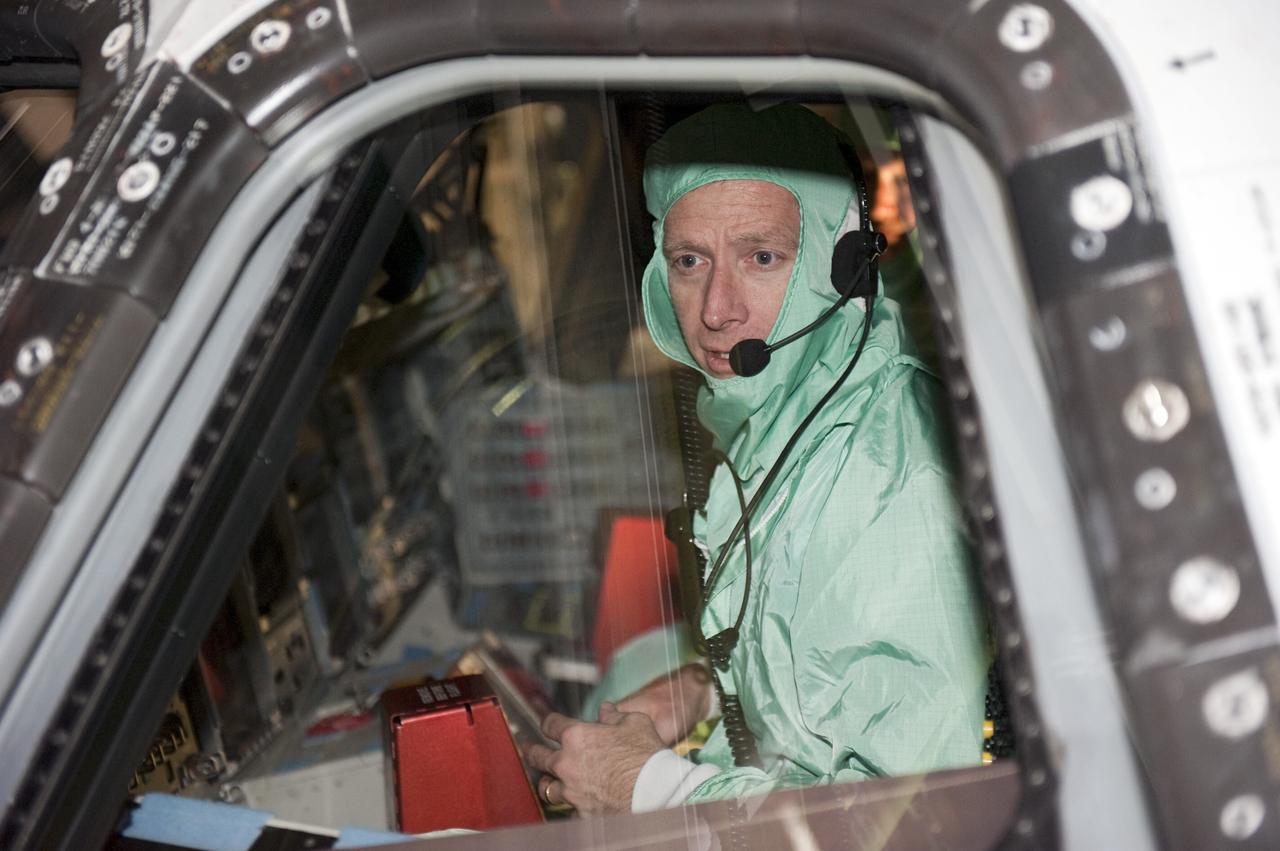 CAPE CANAVERAL, Fla. -- In Orbiter Processing Facility-1 at NASA's Kennedy Space Center in Florida, STS-135 Commander Chris Ferguson checks out shuttle Atlantis' cockpit. The four-member crew is at Kennedy to participate in the Crew Equipment Interface Test (CEIT), which gives them an opportunity for hands-on training with the tools and equipment they'll use and familiarization of the payload they'll deliver to the International Space Station.      Atlantis is being prepared for the STS-135 mission, which will deliver Raffaello multi-purpose logistics module packed with supplies and spare parts to the station. Atlantis is targeted to launch June 28, and will be the last shuttle flight for the Space Shuttle Program. Photo credit: NASA/Kim Shiflett