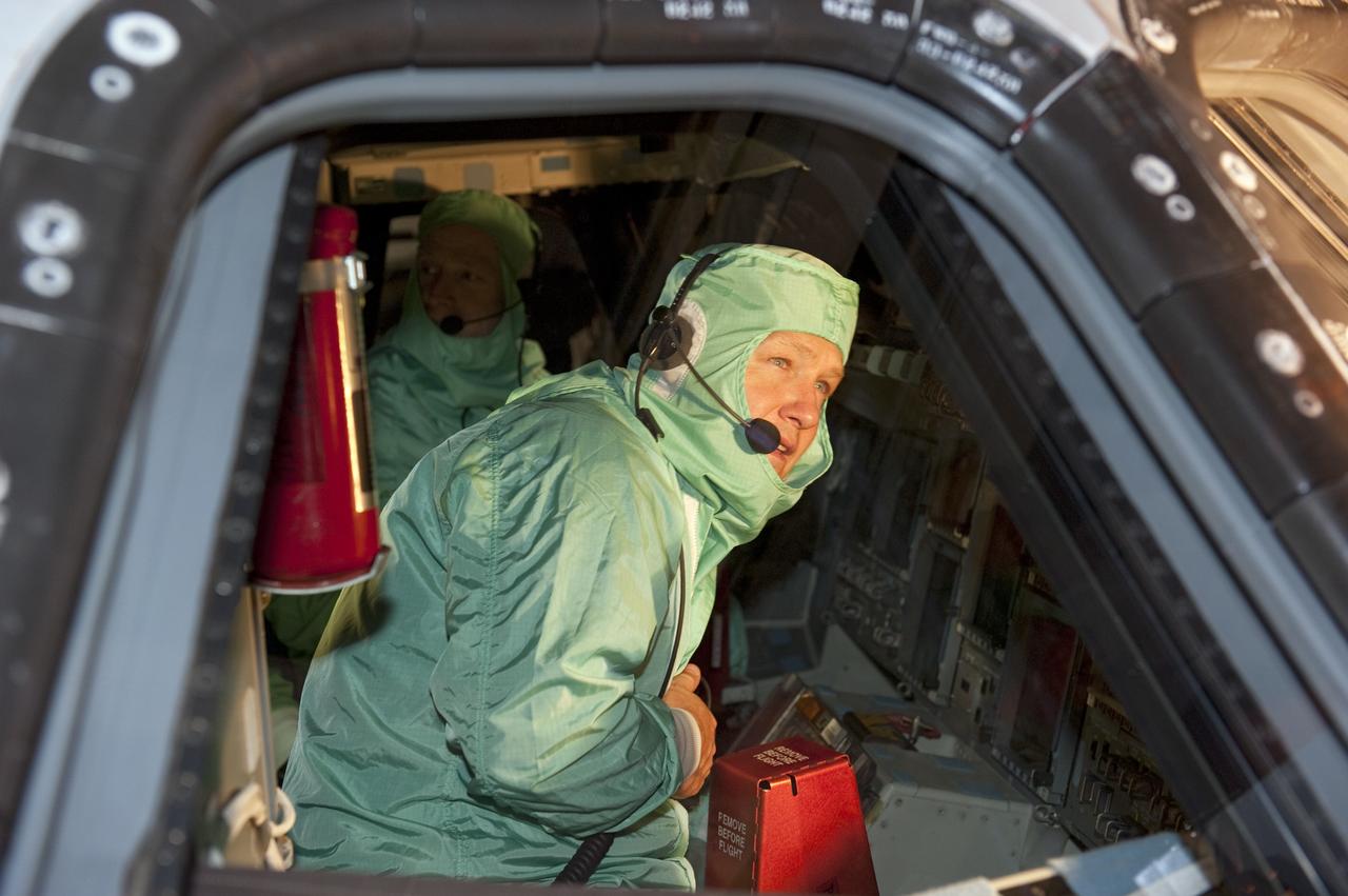CAPE CANAVERAL, Fla. -- In Orbiter Processing Facility-1 at NASA's Kennedy Space Center in Florida, STS-135 Pilot Doug Hurley checks out shuttle Atlantis' cockpit. The four-member crew is at Kennedy to participate in the Crew Equipment Interface Test (CEIT), which gives them an opportunity for hands-on training with the tools and equipment they'll use and familiarization of the payload they'll deliver to the International Space Station.    Atlantis is being prepared for the STS-135 mission, which will deliver Raffaello multi-purpose logistics module packed with supplies and spare parts to the station. Atlantis is targeted to launch June 28, and will be the last shuttle flight for the Space Shuttle Program. Photo credit: NASA/Kim Shiflett