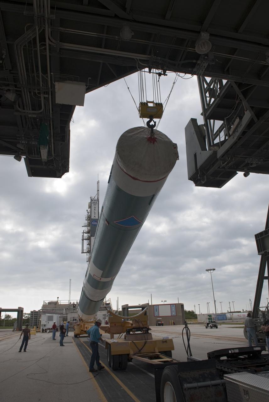 CAPE CANAVERAL, Fla. -- An overhead crane lifts the first stage of a United Launch Alliance Delta II launch vehicle into Pad 17B's gantry at Cape Canaveral Air Force Station in Florida. The Delta II will carry NASA's Gravity Recovery and Interior Laboratory, or GRAIL, spacecraft into lunar orbit. The GRAIL mission is a part of NASA's Discovery Program. GRAIL will fly twin spacecraft in tandem orbits around the moon for several months to measure its gravity field. The mission also will answer longstanding questions about Earth's moon and provide scientists a better understanding of how Earth and other rocky planets in the solar system formed. GRAIL is scheduled to launch September 8, 2011. For more information visit: http://science.nasa.gov/missions/grail/. Photo credit: NASA/Jim Grossmann