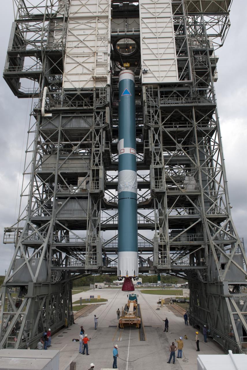 CAPE CANAVERAL, Fla. -- Workers at Cape Canaveral Air Force Station's Pad 17B monitor the progress as the first stage of a United Launch Alliance Delta II launch vehicle is lifted into the gantry. The Delta II will carry NASA's Gravity Recovery and Interior Laboratory, or GRAIL, spacecraft into lunar orbit. The GRAIL mission is a part of NASA's Discovery Program. GRAIL will fly twin spacecraft in tandem orbits around the moon for several months to measure its gravity field. The mission also will answer longstanding questions about Earth's moon and provide scientists a better understanding of how Earth and other rocky planets in the solar system formed. GRAIL is scheduled to launch September 8, 2011. For more information visit: http://science.nasa.gov/missions/grail/. Photo credit: NASA/Jim Grossmann