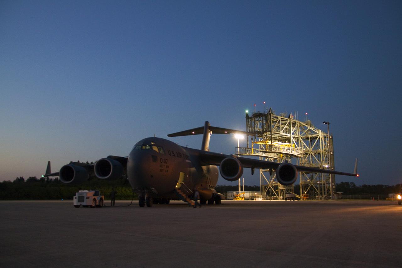 CAPE CANAVERAL, Fla. -- NASA's Juno spacecraft arrives at Kennedy Space Center's Shuttle Landing Facility in Florida aboard an Air Force C-17 jet. Juno was shipped from Lockheed Martin Space Systems in Denver and will be transported to Astrotech's payload processing facility in Titusville, Fla. to begin final preparations for launch.            The solar-powered spacecraft will orbit Jupiter's poles 33 times to find out more about the gas giant's origins, structure, atmosphere and magnetosphere and investigate the existence of a solid planetary core. Juno is scheduled to launch aboard an Atlas V rocket from Cape Canaveral, Fla. Aug. 5. For more information visit, www.nasa.gov/juno. Photo credit: NASA/Jack Pfaller