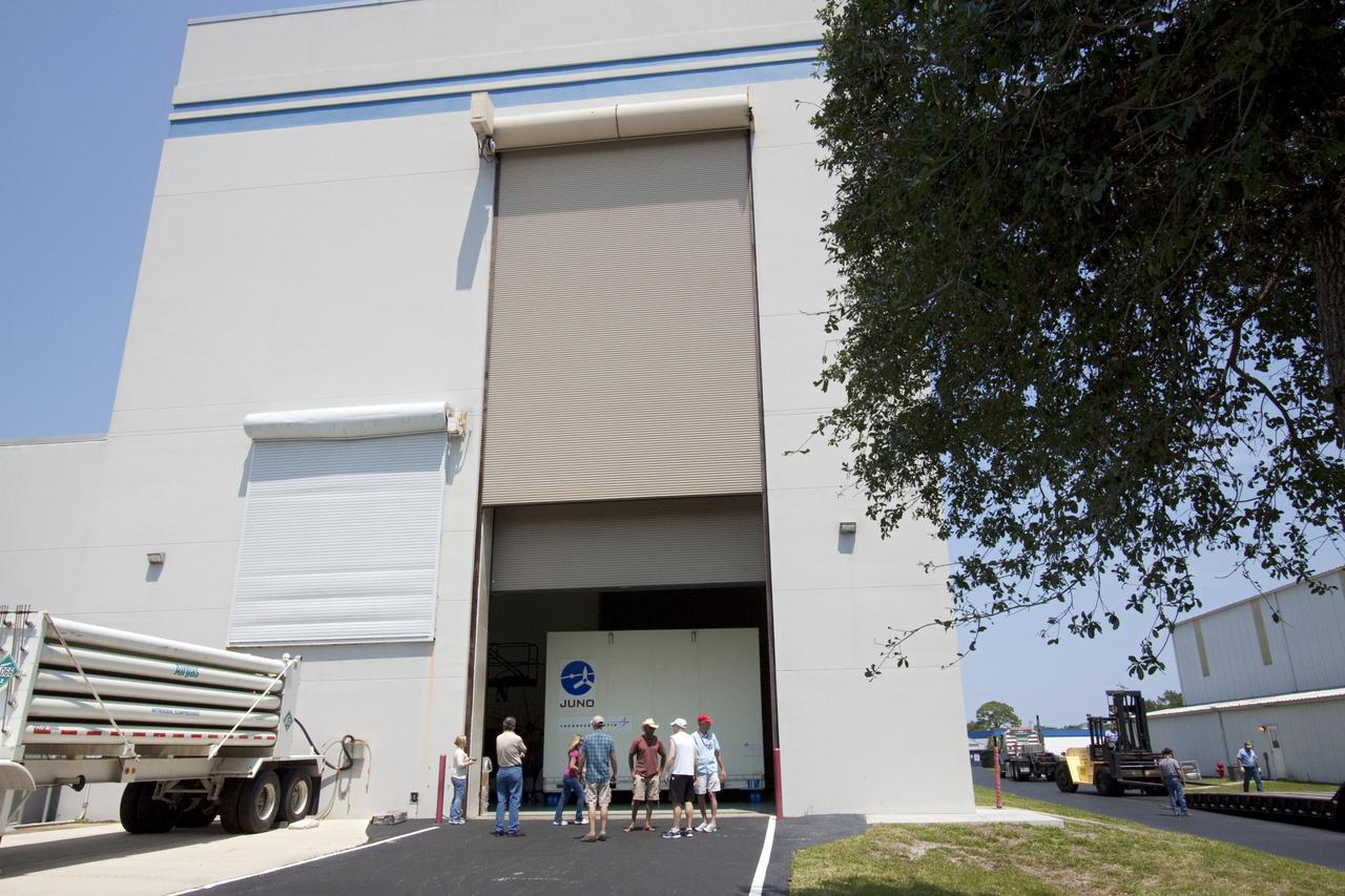 CAPE CANAVERAL, Fla. -- Workers watch the arrival of NASA's Juno spacecraft as it is moved into Astrotech's payload processing facility in Titusville, Fla. to begin final testing and preparations for launch.      The solar-powered spacecraft will orbit Jupiter's poles 33 times to find out more about the gas giant's origins, structure, atmosphere and magnetosphere and investigate the existence of a solid planetary core. Juno is scheduled to launch aboard an Atlas V rocket from Cape Canaveral, Fla. Aug. 5. For more information visit, www.nasa.gov/juno. Photo credit: NASA/Jack Pfaller    It will splash down into the Atlantic Ocean where the ship and its crew will recover it and tow it back through Port Canaveral for refurbishing for another launch. The STS-124 mission is the second of three flights launching components to complete the Japan Aerospace Exploration Agency's Kibo laboratory. The shuttle crew will install Kibo's large Japanese Pressurized Module and its remote manipulator system, or RMS. Photo credit: USA/Jeff Suter