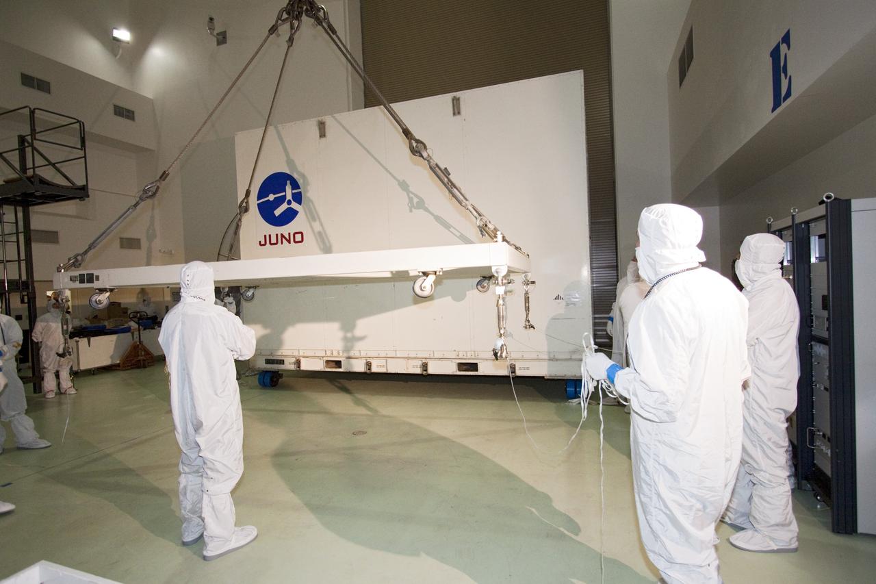 CAPE CANAVERAL, Fla. -- Technicians guide an overhead crane toward the container holding NASA's Juno spacecraft. The container will be lifted away from the spacecraft, moved into an airlock at Astrotech's payload processing facility in Titusville, Fla. to begin final testing and preparations for launch.          The solar-powered spacecraft will orbit Jupiter's poles 33 times to find out more about the gas giant's origins, structure, atmosphere and magnetosphere and investigate the existence of a solid planetary core. Juno is scheduled to launch aboard an Atlas V rocket from Cape Canaveral, Fla. Aug. 5. For more information visit, www.nasa.gov/juno. Photo credit: NASA/Jack Pfaller    It will splash down into the Atlantic Ocean where the ship and its crew will recover it and tow it back through Port Canaveral for refurbishing for another launch. The STS-124 mission is the second of three flights launching components to complete the Japan Aerospace Exploration Agency's Kibo laboratory. The shuttle crew will install Kibo's large Japanese Pressurized Module and its remote manipulator system, or RMS. Photo credit: USA/Jeff Suter