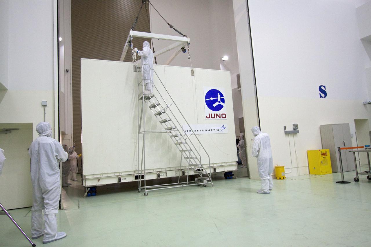 CAPE CANAVERAL, Fla. -- Technicians guide an overhead crane toward the container holding NASA's Juno spacecraft. The container will be lifted away from the spacecraft, moved into an airlock at Astrotech's payload processing facility in Titusville, Fla. to begin final testing and preparations for launch.        The solar-powered spacecraft will orbit Jupiter's poles 33 times to find out more about the gas giant's origins, structure, atmosphere and magnetosphere and investigate the existence of a solid planetary core. Juno is scheduled to launch aboard an Atlas V rocket from Cape Canaveral, Fla. Aug. 5. For more information visit, www.nasa.gov/juno. Photo credit: NASA/Jack Pfaller    It will splash down into the Atlantic Ocean where the ship and its crew will recover it and tow it back through Port Canaveral for refurbishing for another launch. The STS-124 mission is the second of three flights launching components to complete the Japan Aerospace Exploration Agency's Kibo laboratory. The shuttle crew will install Kibo's large Japanese Pressurized Module and its remote manipulator system, or RMS. Photo credit: USA/Jeff Suter