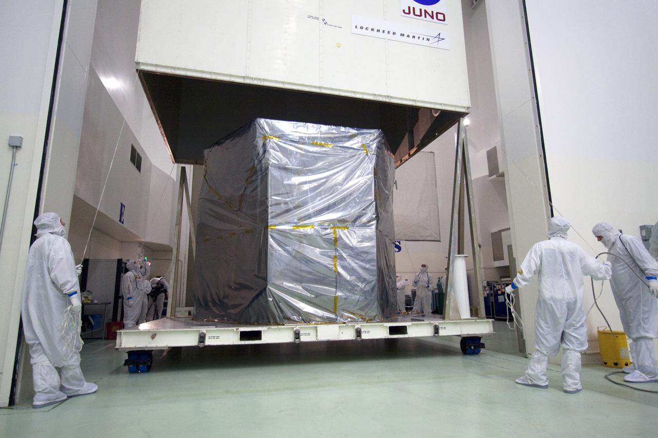 CAPE CANAVERAL, Fla. -- The container holding NASA's Juno spacecraft is being removed by an overhead crane as technicians monitor the progress. The spacecraft will then moved into an airlock at Astrotech's payload processing facility in Titusville, Fla. to begin final testing and preparations for launch.          The solar-powered spacecraft will orbit Jupiter's poles 33 times to find out more about the gas giant's origins, structure, atmosphere and magnetosphere and investigate the existence of a solid planetary core. Juno is scheduled to launch aboard an Atlas V rocket from Cape Canaveral, Fla. Aug. 5. For more information visit, www.nasa.gov/juno. Photo credit: NASA/Jack Pfaller    It will splash down into the Atlantic Ocean where the ship and its crew will recover it and tow it back through Port Canaveral for refurbishing for another launch. The STS-124 mission is the second of three flights launching components to complete the Japan Aerospace Exploration Agency's Kibo laboratory. The shuttle crew will install Kibo's large Japanese Pressurized Module and its remote manipulator system, or RMS. Photo credit: USA/Jeff Suter