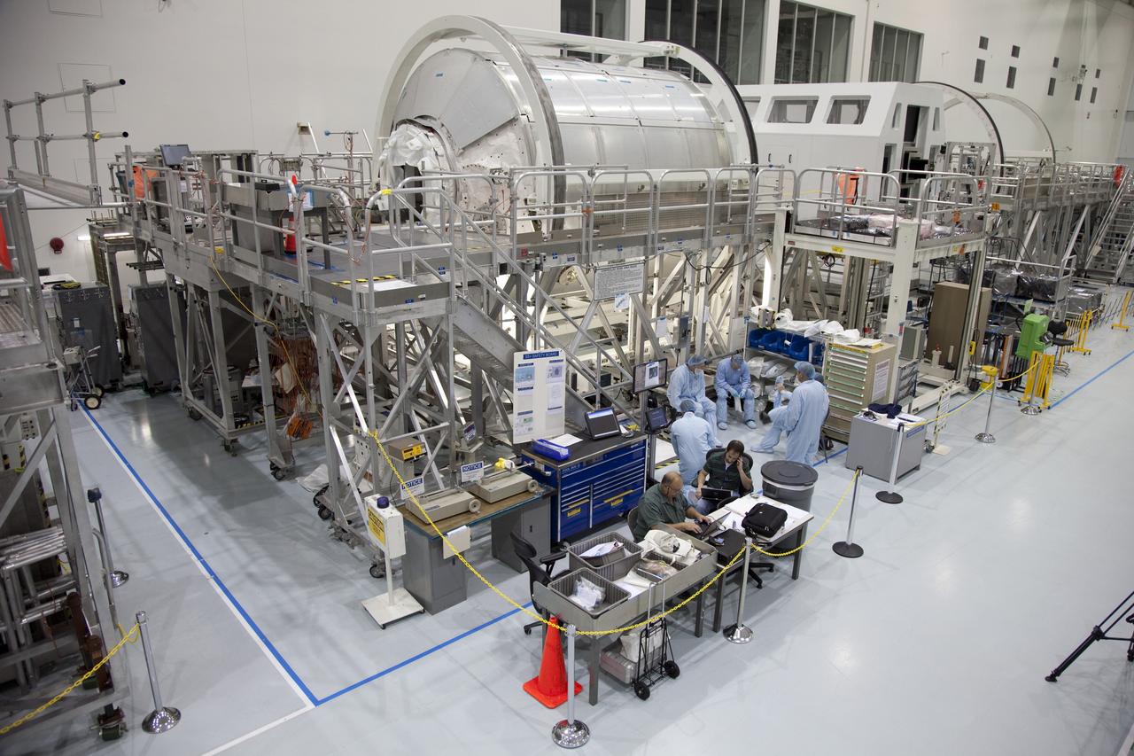 CAPE CANAVERAL, Fla. -- In the Space Station Processing Facility at NASA's Kennedy Space Center in Florida, technicians garbed in protective wear, commonly known as 'bunny suits,' prepare to install the cargo inside the Raffaello multi-purpose logistics module  for shuttle Atlantis' flight to the International Space Station.              Atlantis and its payload is being prepared for the STS-135 mission, which will deliver the Raffaello multi-purpose logistics module packed with supplies and spare parts to the station. Atlantis is targeted to launch June 28, and will be the last shuttle flight for the Space Shuttle Program. For more information visit, http://www.nasa.gov/mission_pages/shuttle/shuttlemissions/sts135/index.html. Photo credit: NASA/Frankie Martin