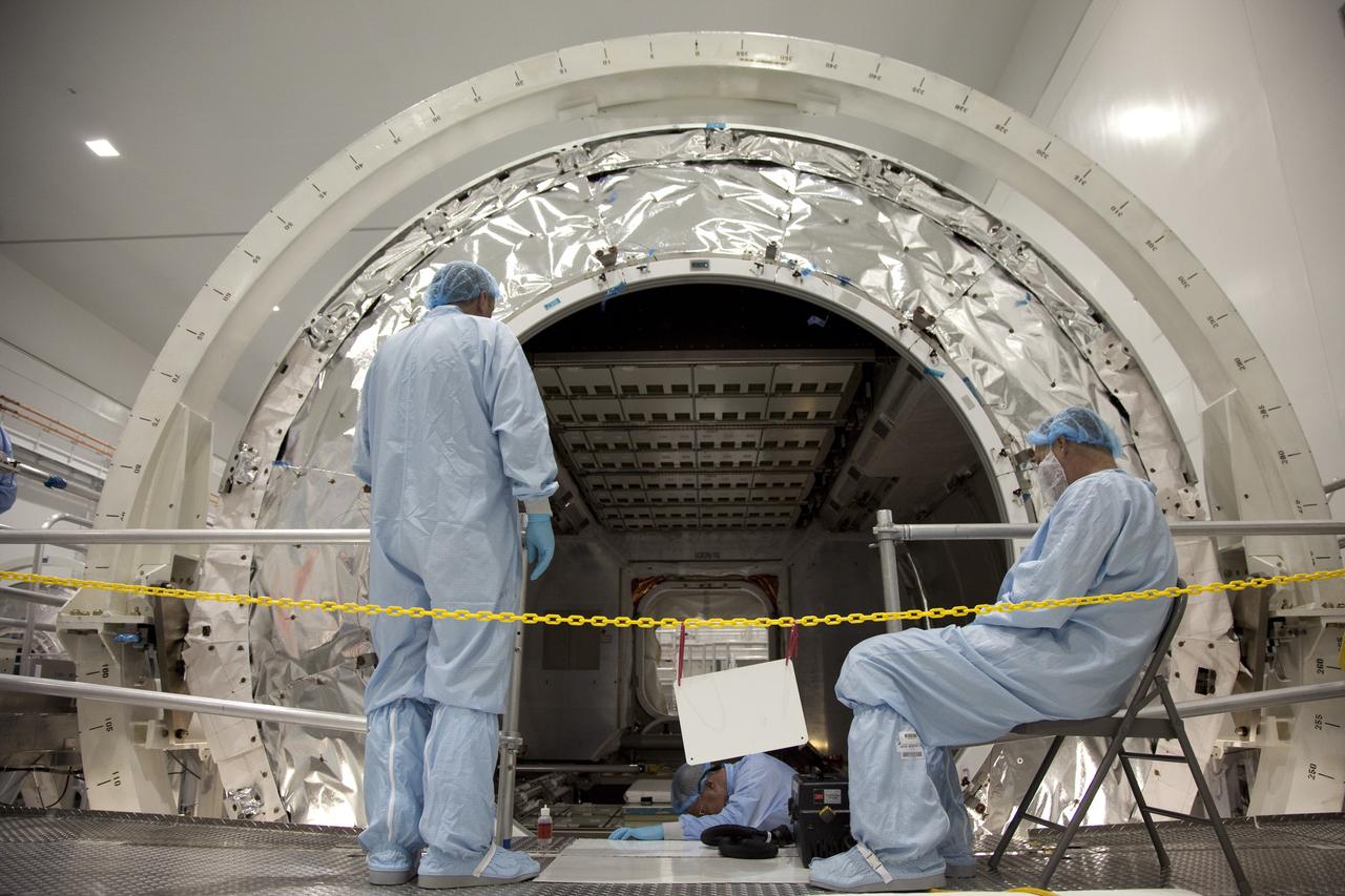 CAPE CANAVERAL, Fla. -- In the Space Station Processing Facility at NASA's Kennedy Space Center in Florida, technicians garbed in protective wear, commonly known as 'bunny suits,' prepare to install the cargo inside the Raffaello multi-purpose logistics module  for shuttle Atlantis' flight to the International Space Station.            Atlantis and its payload is being prepared for the STS-135 mission, which will deliver the Raffaello multi-purpose logistics module packed with supplies and spare parts to the station. Atlantis is targeted to launch June 28, and will be the last shuttle flight for the Space Shuttle Program. For more information visit, http://www.nasa.gov/mission_pages/shuttle/shuttlemissions/sts135/index.html. Photo credit: NASA/Frankie Martin