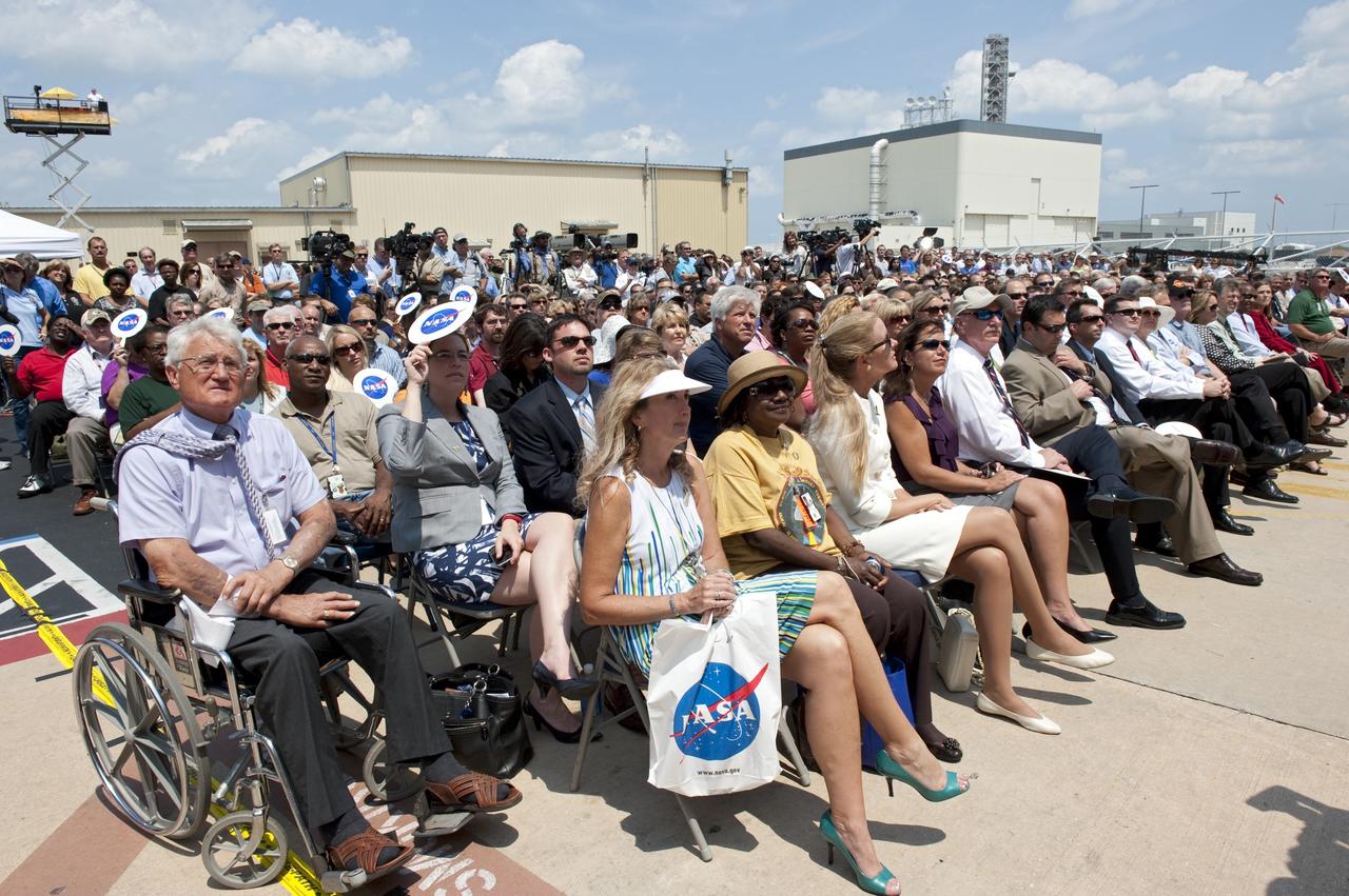 CAPE CANAVERAL, Fla. -- NASA officials, Florida representatives, Kennedy employees and media await an announcement that will reveal which of the four institutions will receive shuttle orbiters for permanent display.       In a ceremony held in front of Orbiter Processing Facility-1 at NASA's Kennedy Space Center in Florida, NASA Administrator Charles Bolden announced the facilities where four shuttle orbiters will be displayed permanently at the conclusion of the Space Shuttle Program. Shuttle Enterprise, the first orbiter built, will move from the Smithsonian's National Air and Space Museum Steven F. Udvar-Hazy Center in Virginia to the Intrepid Sea, Air & Space Museum in New York. The Udvar-Hazy Center will become the new home for shuttle Discovery, which retired after completing its 39th mission in March. Shuttle Endeavour, which is preparing for its final flight at the end of the month, will go to the California Science Center in Los Angeles. Atlantis, which will fly the last planned shuttle mission in June, will be displayed at the Kennedy Space Center Visitor Complex in Florida. Later, employees, their families and friends, will celebrate the 30th anniversary of the first shuttle launch at the visitor complex.  Photo credit: NASA/Kim Shiflett