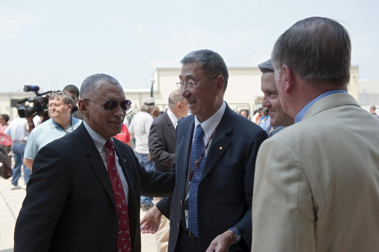 CAPE CANAVERAL, Fla. -- NASA Administrator Charles Bolden, left, speaks with Professor Sam Ting, Alpha Magnetic Spectrometer-2 principal investigator at the Massachusetts Institute of Technology, Kennedy Center Director Bob Cabana and STS-1 Pilot and former Kennedy Space Center Director Bob Crippen. In a ceremony held in front of Orbiter Processing Facility-1 at NASA's Kennedy Space Center in Florida, NASA Administrator Charles Bolden announced the facilities where four shuttle orbiters will be displayed permanently at the conclusion of the Space Shuttle Program. Shuttle Enterprise, the first orbiter built, will move from the Smithsonian's National Air and Space Museum Steven F. Udvar-Hazy Center in Virginia to the Intrepid Sea, Air & Space Museum in New York. The Udvar-Hazy Center will become the new home for shuttle Discovery, which retired after completing its 39th mission in March. Shuttle Endeavour, which is preparing for its final flight at the end of the month, will go to the California Science Center in Los Angeles. Atlantis, which will fly the last planned shuttle mission in June, will be displayed at the Kennedy Space Center Visitor Complex in Florida. Later, employees, their families and friends, will celebrate the 30th anniversary of the first shuttle launch at the visitor complex. Photo credit: NASA/Kim Shiflett