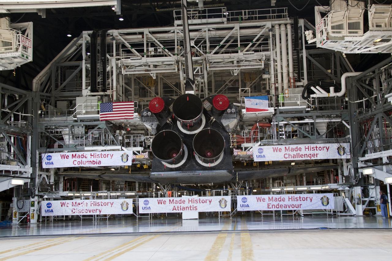 CAPE CANAVERAL, Fla. -- Shuttle Atlantis' three main engines take center stage to the banners commemorating the orbiters that served the Space Shuttle Program. In a ceremony held in front of Orbiter Processing Facility-1 at NASA's Kennedy Space Center in Florida, NASA Administrator Charles Bolden announced the facilities where four shuttle orbiters will be displayed permanently at the conclusion of the Space Shuttle Program. Shuttle Enterprise, the first orbiter built, will move from the Smithsonian's National Air and Space Museum Steven F. Udvar-Hazy Center in Virginia to the Intrepid Sea, Air & Space Museum in New York. The Udvar-Hazy Center will become the new home for shuttle Discovery, which retired after completing its 39th mission in March. Shuttle Endeavour, which is preparing for its final flight at the end of the month, will go to the California Science Center in Los Angeles. Atlantis, which will fly the last planned shuttle mission in June, will be displayed at the Kennedy Space Center Visitor Complex in Florida. The event also commemorated the 30th anniversary of the first space shuttle launch with the launch of shuttle Columbia. Photo credit: NASA/Kim Shiflett