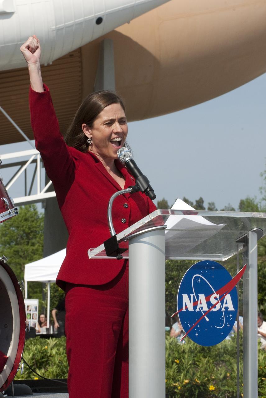 CAPE CANAVERAL, Fla. -- Standing in front of a replica of a space shuttle at NASA's Kennedy Space Center Visitor Complex in Florida, Rita Willcoxon, Launch Vehicle Processing director, kicks off the event enthusiastically speaking to an audience attending the 30th anniversary celebration in honor of the Space Shuttle Program's first shuttle launch. The celebration followed an announcement by NASA Administrator Charles Bolden where the four orbiters will be placed for permanent display after retirement. Photo credit: NASA/Kim Shiflett