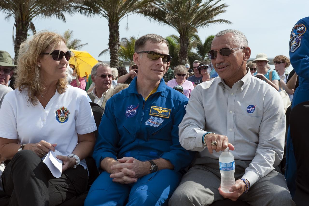 CAPE CANAVERAL, Fla. -- Patty Stratton, associate program manager for Ground Operations at United Space Alliance, NASA Astronaut and STS-135 Commander Chris Ferguson and NASA Administrator Charles Bolden take a moment to converse on a very warm, sunny Florida afternoon while attending the 30th anniversary celebration in honor of the Space Shuttle Program's first shuttle launch. The event is being held at NASA's Kennedy Space Center Visitor Complex. The celebration followed an announcement by NASA Administrator Charles Bolden where the four orbiters will be placed for permanent display after retirement. Photo credit: NASA/Kim Shiflett