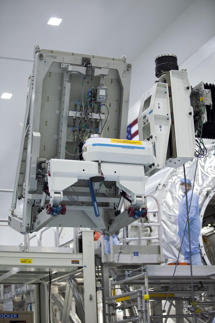 CAPE CANAVERAL, Fla. -- In the Space Station Processing Facility at NASA's Kennedy Space Center in Florida, technicians monitor the progress of cargo as it is being prepared for installation inside the Raffaello multi-purpose logistics module for shuttle Atlantis' flight to the International Space Station.        Atlantis and its payload is being prepared for the STS-135 mission, which will deliver the Raffaello multi-purpose logistics module packed with supplies and spare parts to the station. Atlantis is targeted to launch June 28, and will be the last shuttle flight for the Space Shuttle Program. For more information visit, http://www.nasa.gov/mission_pages/shuttle/shuttlemissions/sts135/index.html. Photo credit: NASA/Frankie Martin