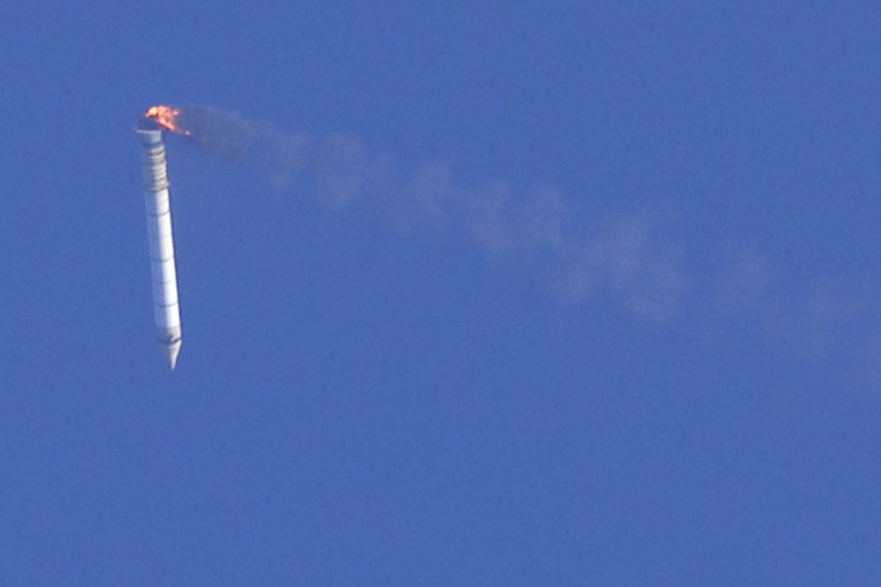 CAPE CANAVERAL, Fla. -- This image taken from the deck of NASA's SRB retrieval ship Freedom Star shows the right hand solid rocket booster from space shuttle Discovery's STS-124 launch falling through the atmosphere while burning off the remainder of its fuel. It will splash down into the Atlantic Ocean where the ship and its crew will recover it and tow it back through Port Canaveral for refurbishing for another launch. The STS-124 mission is the second of three flights launching components to complete the Japan Aerospace Exploration Agency's Kibo laboratory. The shuttle crew will install Kibo's large Japanese Pressurized Module and its remote manipulator system, or RMS. Photo credit: USA/Jeff Suter