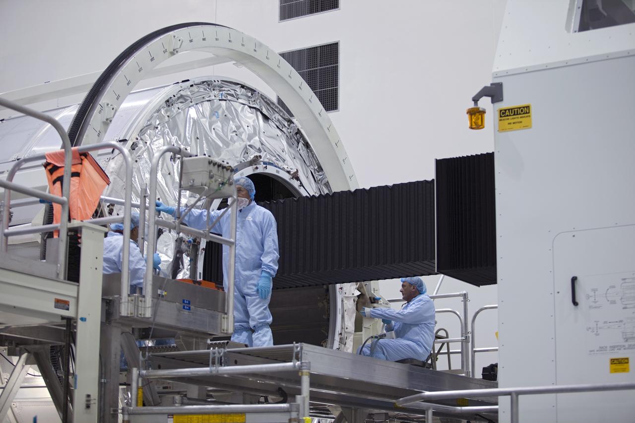 CAPE CANAVERAL, Fla. -- In the Space Station Processing Facility at NASA's Kennedy Space Center in Florida, technicians garbed in protective wear, commonly known as 'bunny suits,' install cargo inside the Raffaello multi-purpose logistics module for shuttle Atlantis' flight to the International Space Station.          Atlantis and its payload is being prepared for the STS-135 mission, which will deliver the Raffaello multi-purpose logistics module packed with supplies and spare parts to the station. Atlantis is targeted to launch June 28, and will be the last shuttle flight for the Space Shuttle Program. For more information visit, http://www.nasa.gov/mission_pages/shuttle/shuttlemissions/sts135/index.html. Photo credit: NASA/Frankie Martin