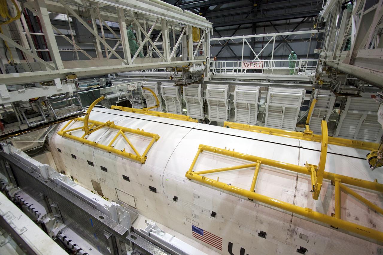 CAPE CANAVERAL, Fla. - In Orbiter Processing Facility-1 at NASA's Kennedy Space Center in Florida, the clamshell doors of space shuttle Atlantis' payload bay have been closed in preparation for the its move to the Vehicle Assembly Building next month. Atlantis is being prepared for the STS-135 mission, which will deliver the Raffaello multipurpose logistics module packed with supplies, logistics and spare parts to the International Space Station. STS-135 is targeted to launch June 28, and will be the last spaceflight for the Space Shuttle Program. Photo credit: NASA/Jack Pfaller
