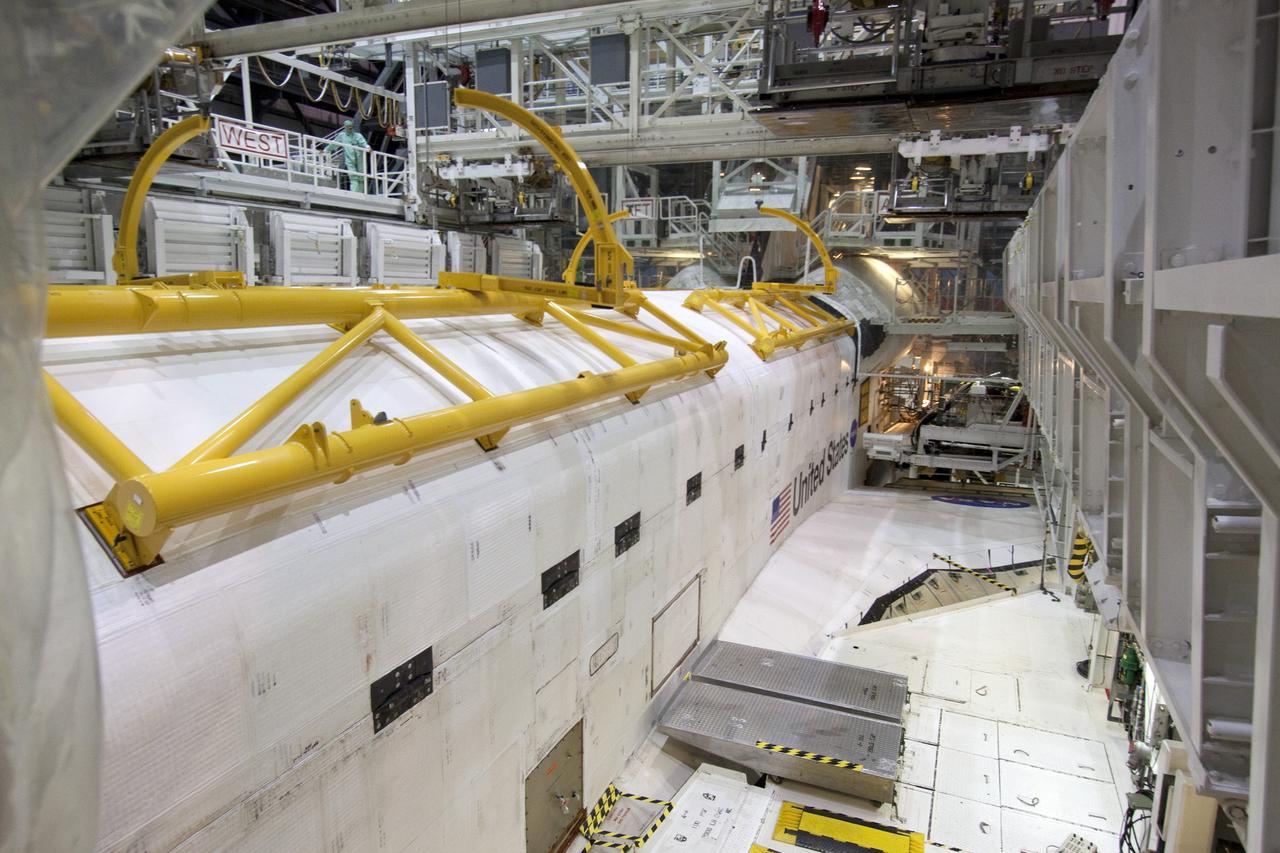 CAPE CANAVERAL, Fla. - In Orbiter Processing Facility-1 at NASA's Kennedy Space Center in Florida, the clamshell doors of space shuttle Atlantis' payload bay have been closed in preparation for the its move to the Vehicle Assembly Building next month. Atlantis is being prepared for the STS-135 mission, which will deliver the Raffaello multipurpose logistics module packed with supplies, logistics and spare parts to the International Space Station. STS-135 is targeted to launch June 28, and will be the last spaceflight for the Space Shuttle Program. Photo credit: NASA/Jack Pfaller